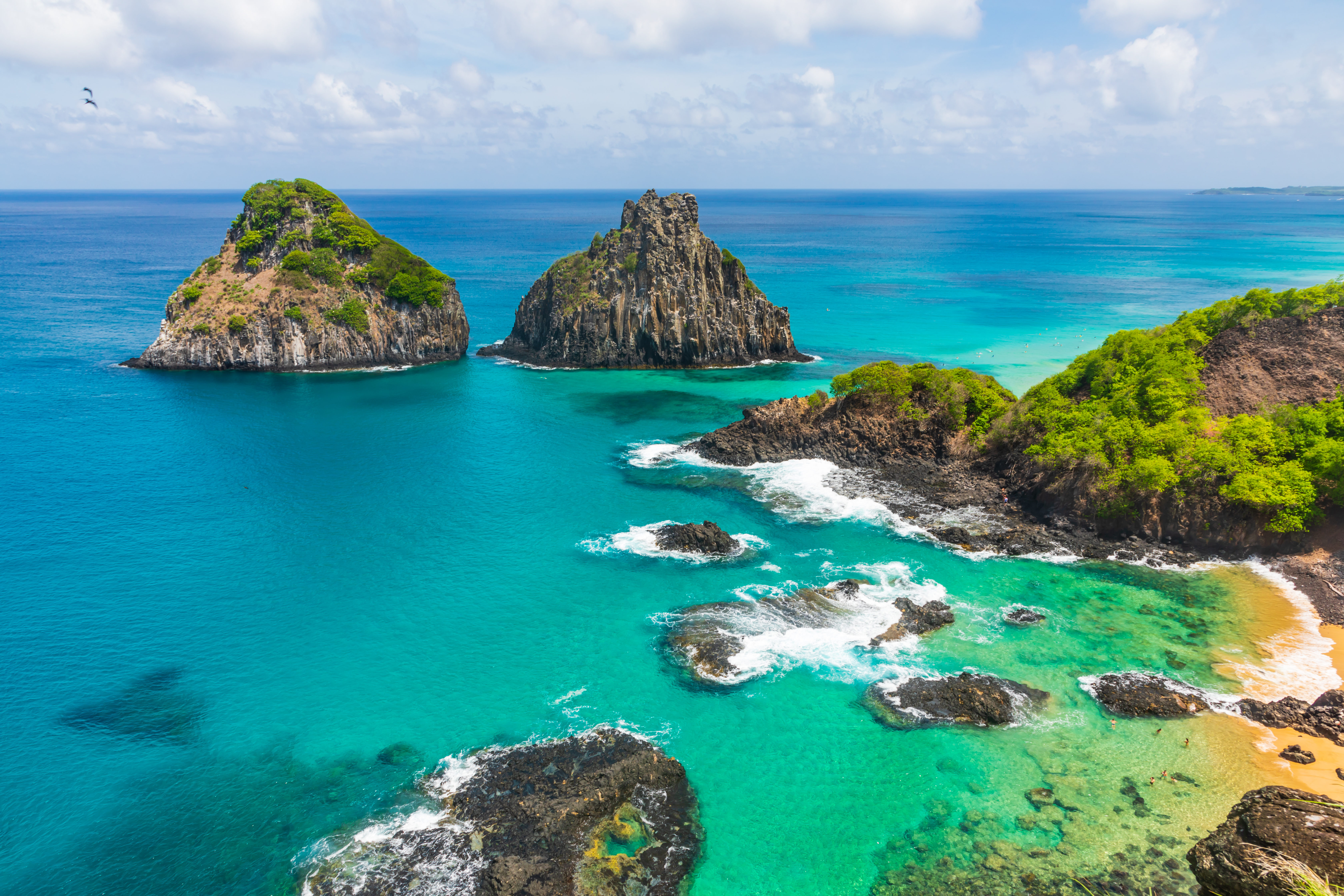 Aerial view of tropical island coastline with beautiful waters