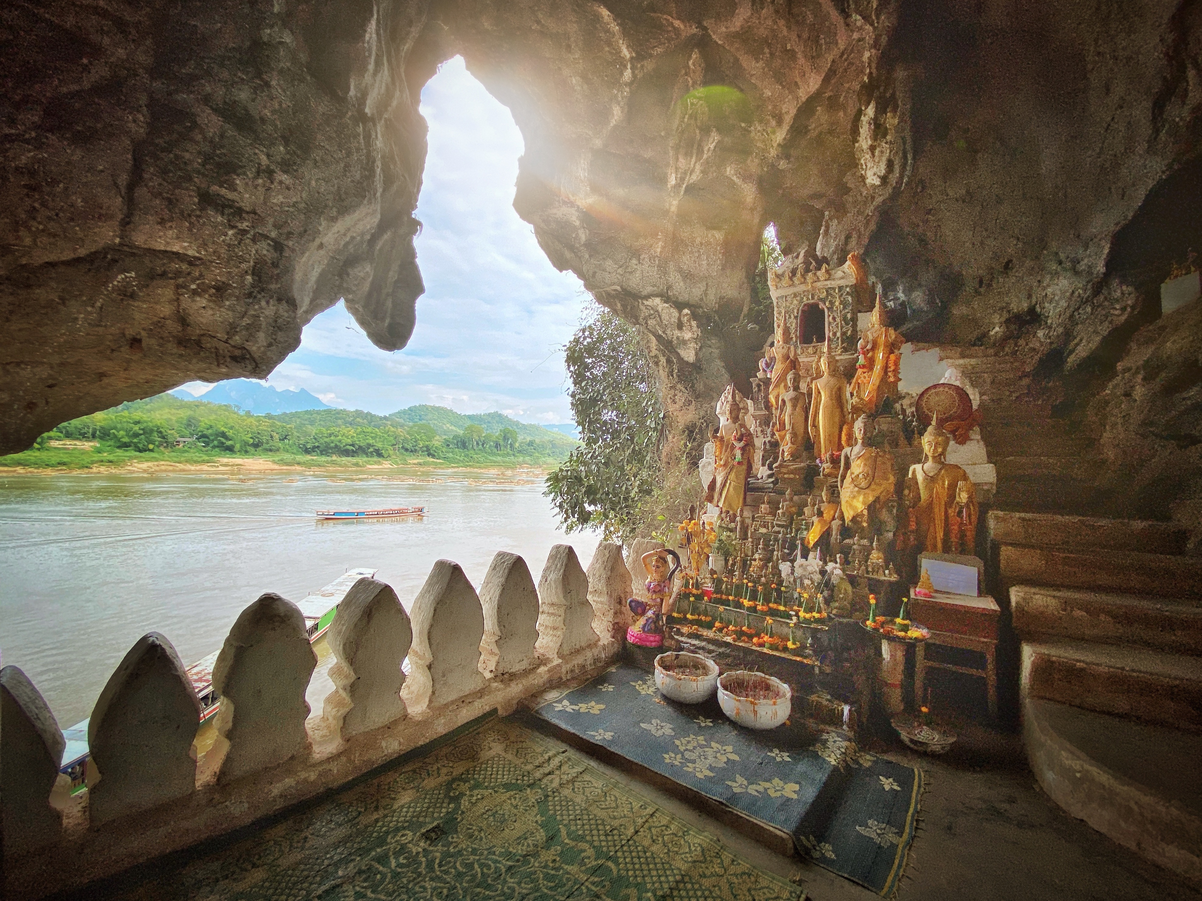 Sunbeam into the Pak Ou Cave Buddha Shrine at Tham Ting Buddhist Cave. Mekong River, Luang Prabang, Laos