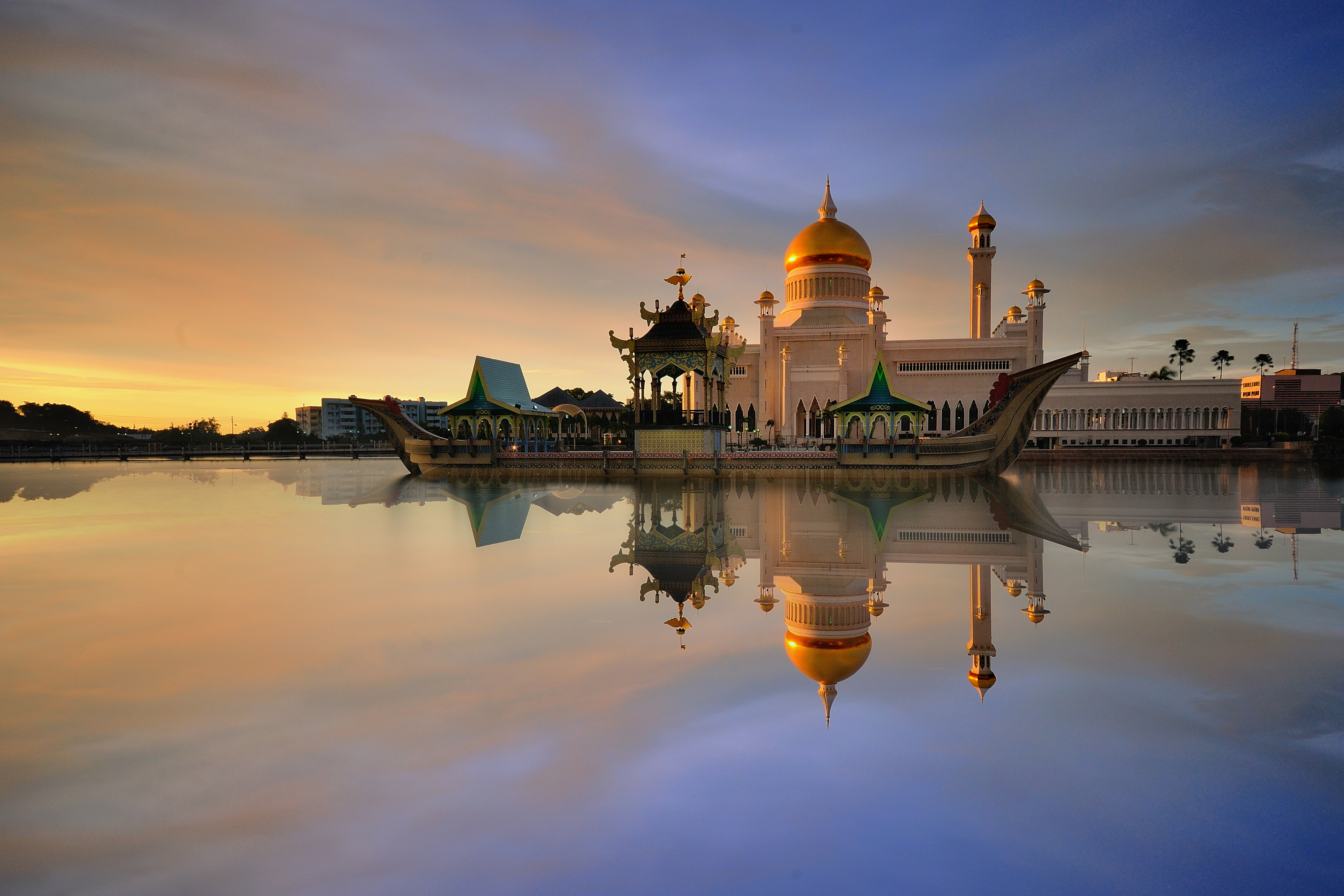 Sunset view of Sultan Omar Ali Saifudding Mosque, Bandar Seri Begawan, Brunei, Southeast Asia with reflection in water