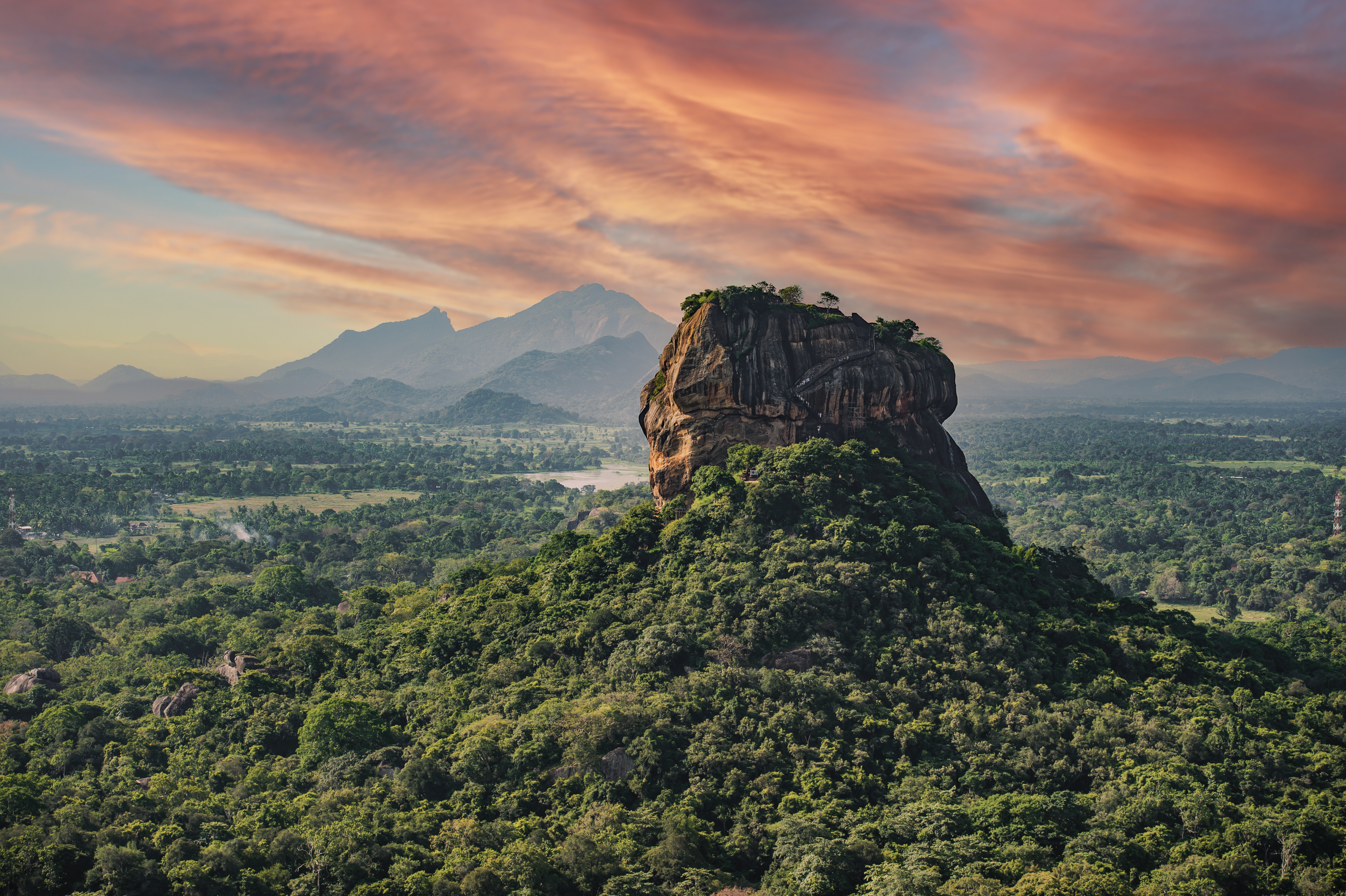 "View of the Lion rock surrounded by green rich vegetation, photo taken from Pidurangala Rock in Sigiriya, Sri Lanka.  "