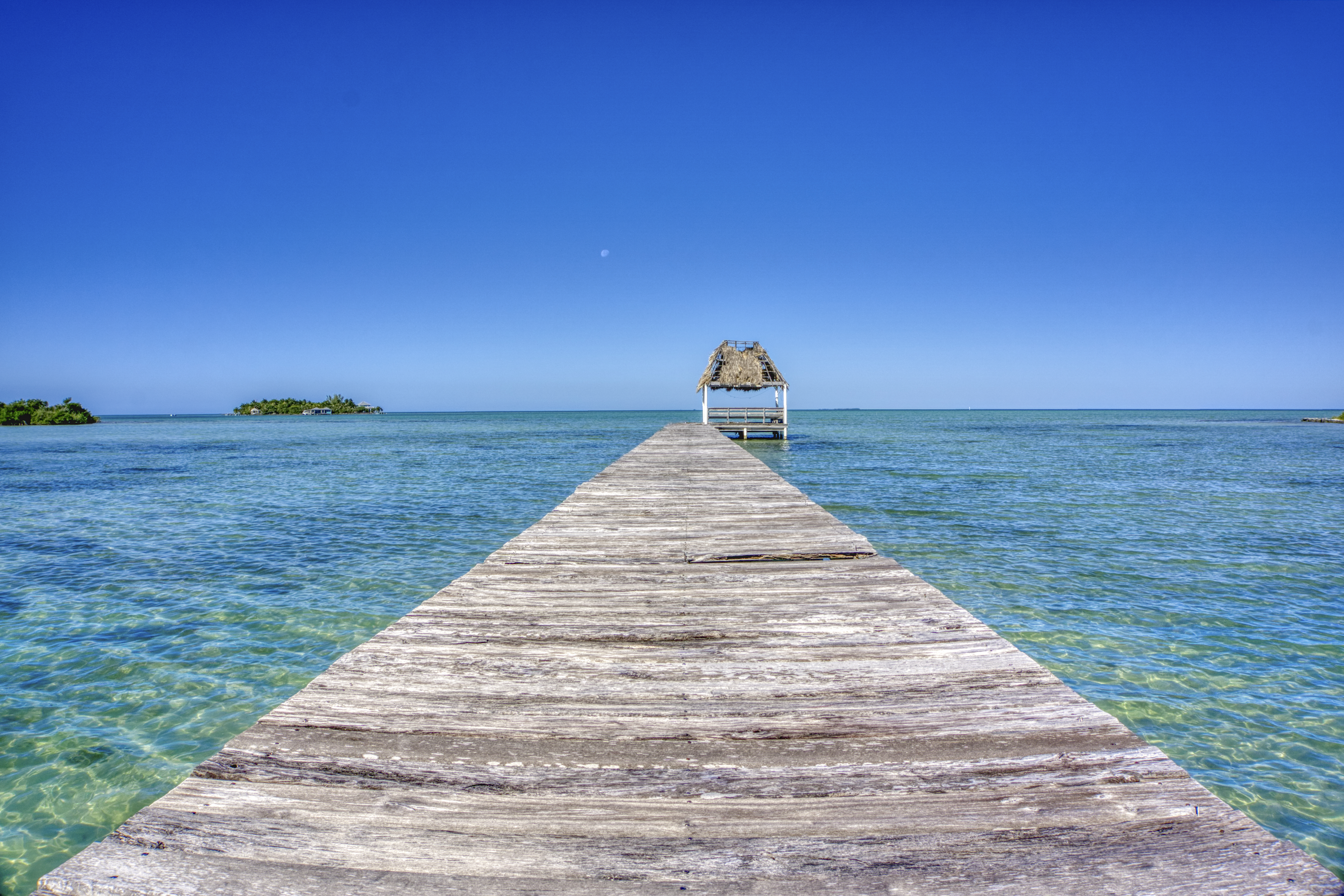 Pier over the blue sea on San Pedro Island in the Caribbean nation of Belize