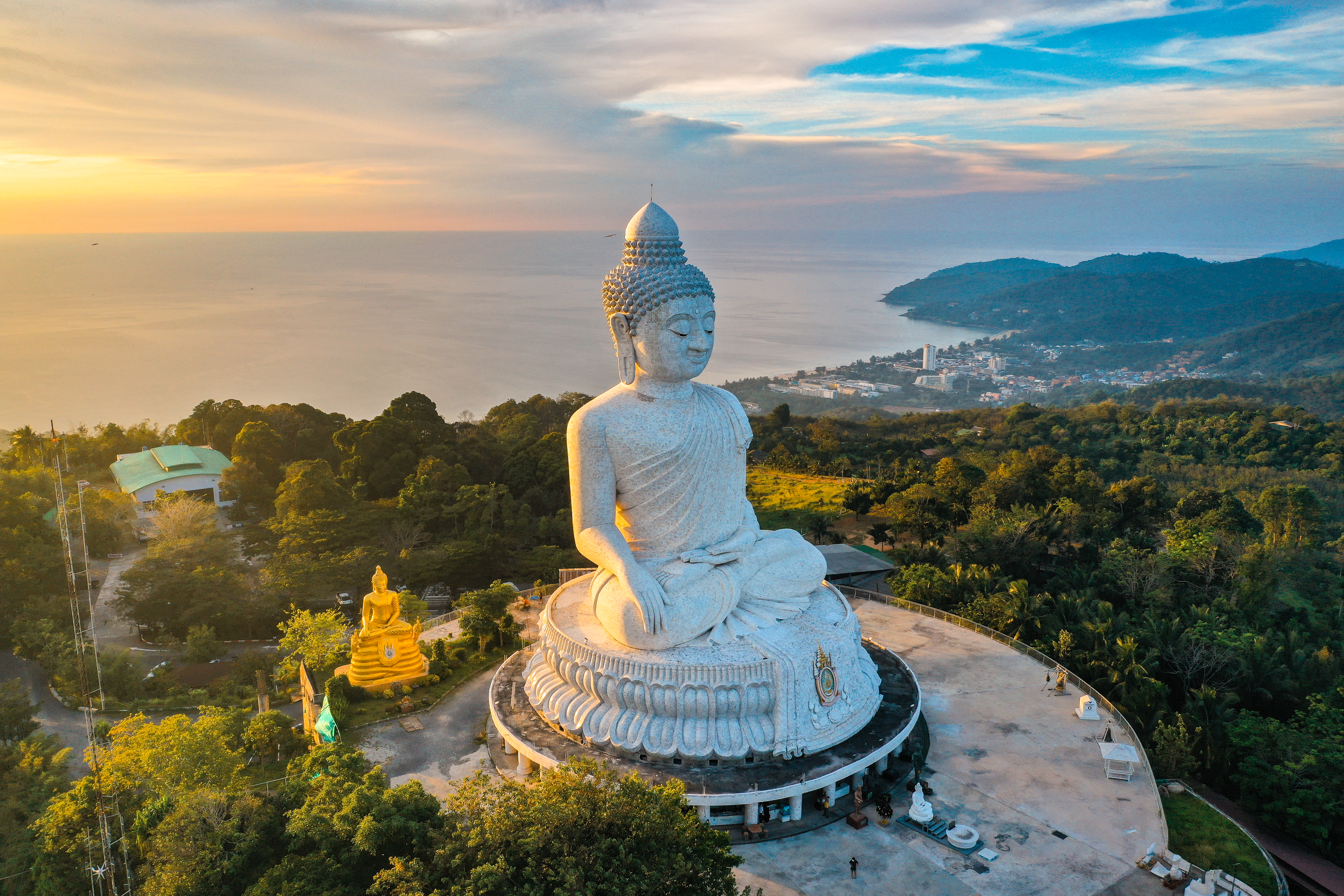 Aerial view of Big Buddha viewpoint at sunset on Phuket with a view of the water and coast below