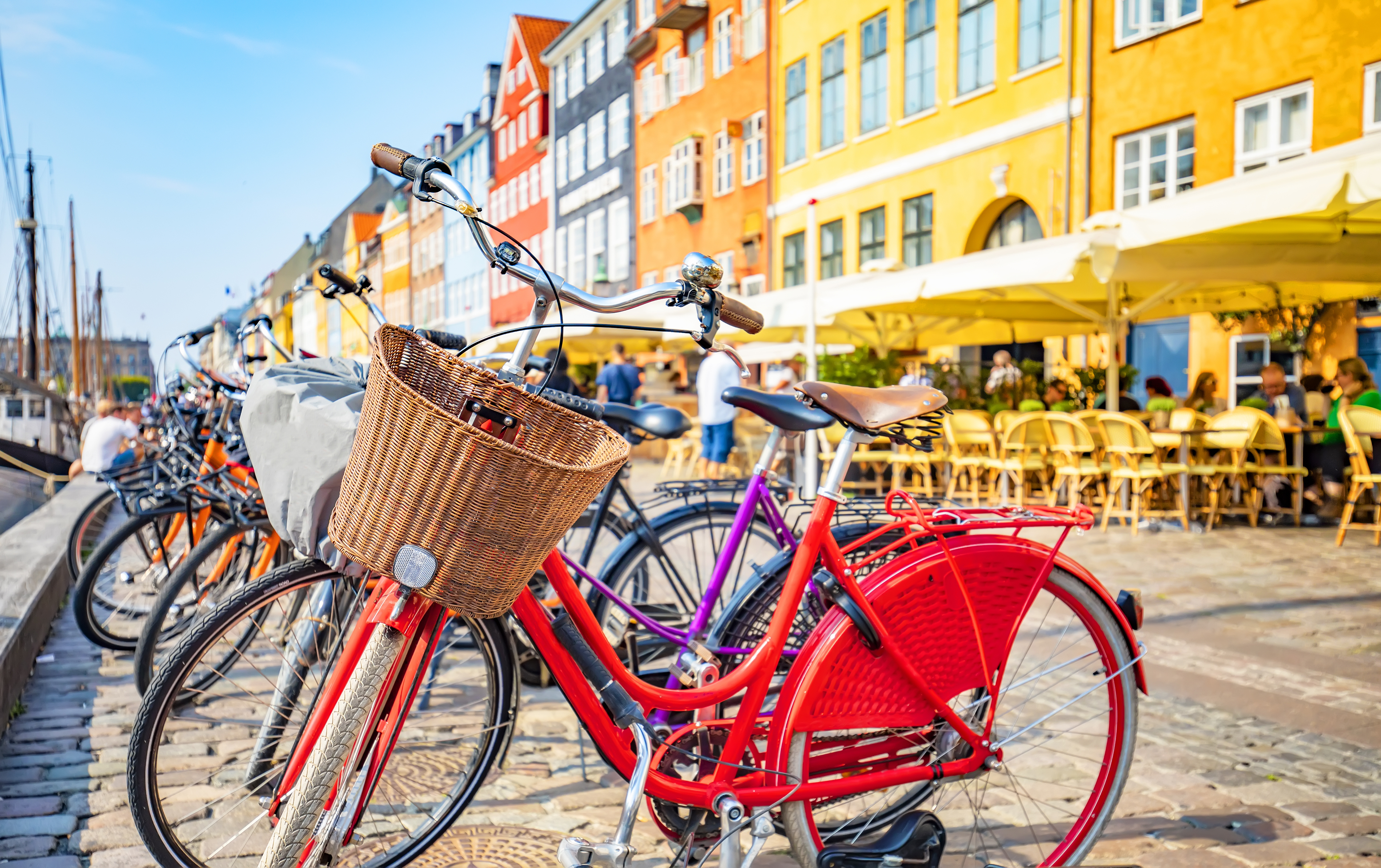 Scenic view of Copenhagen old town, Nyhavn harbor, selective focus on a front bicycle