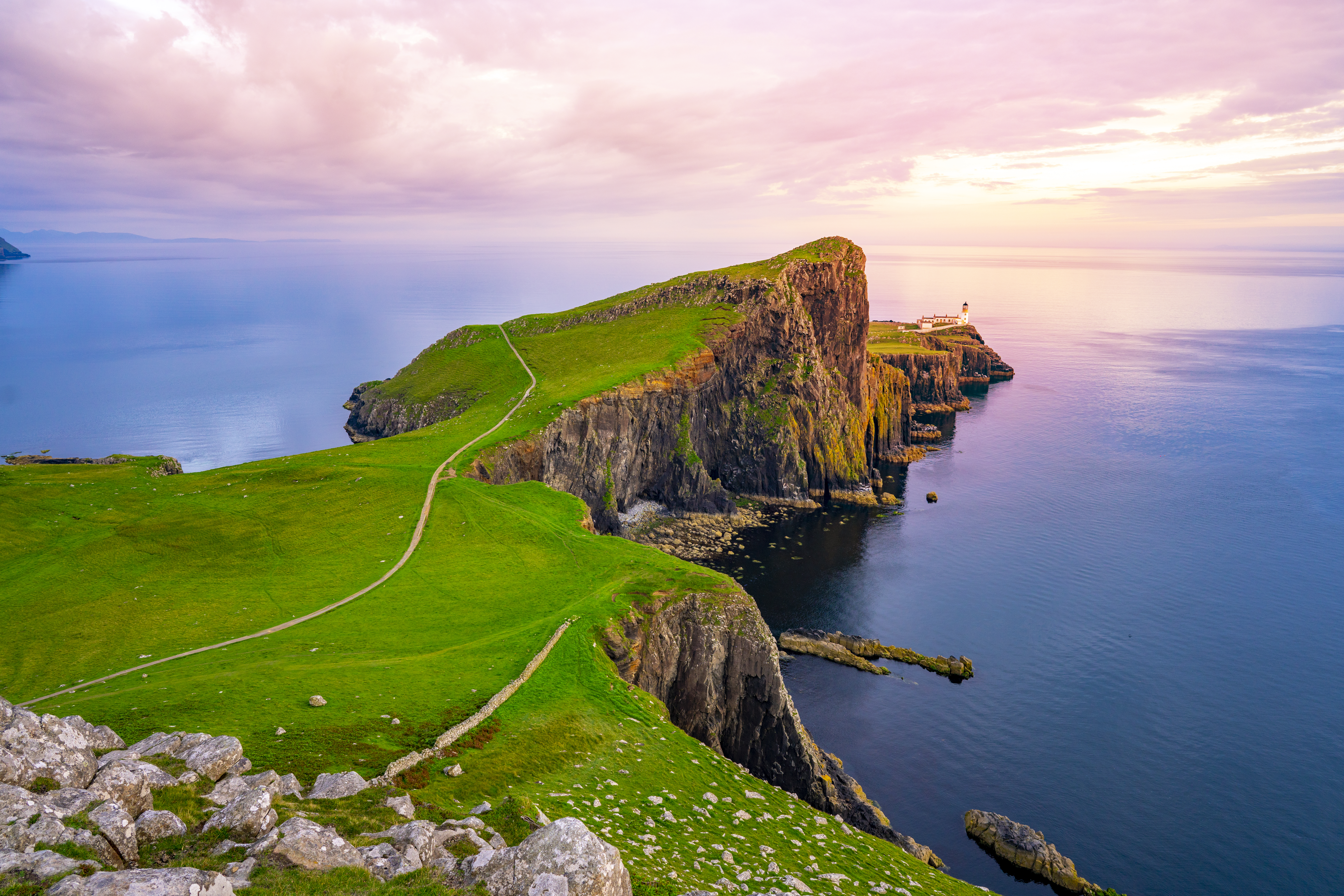 Lightouse at edge of cliff overlooking atlantic ocean