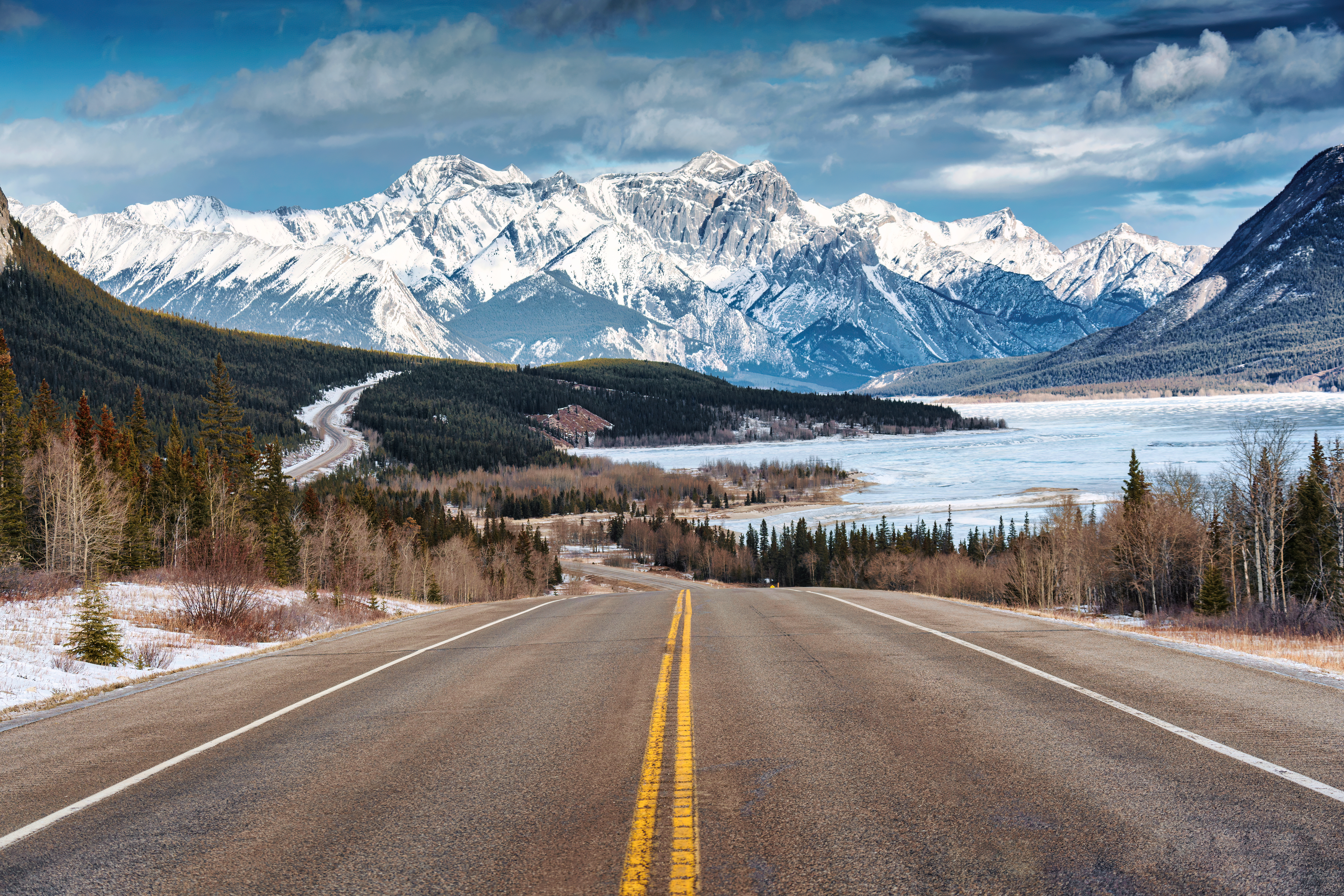 Icefields Parkway, Alberta Beautiful scenery of Road trip on highway with rocky mountains and frozen lake