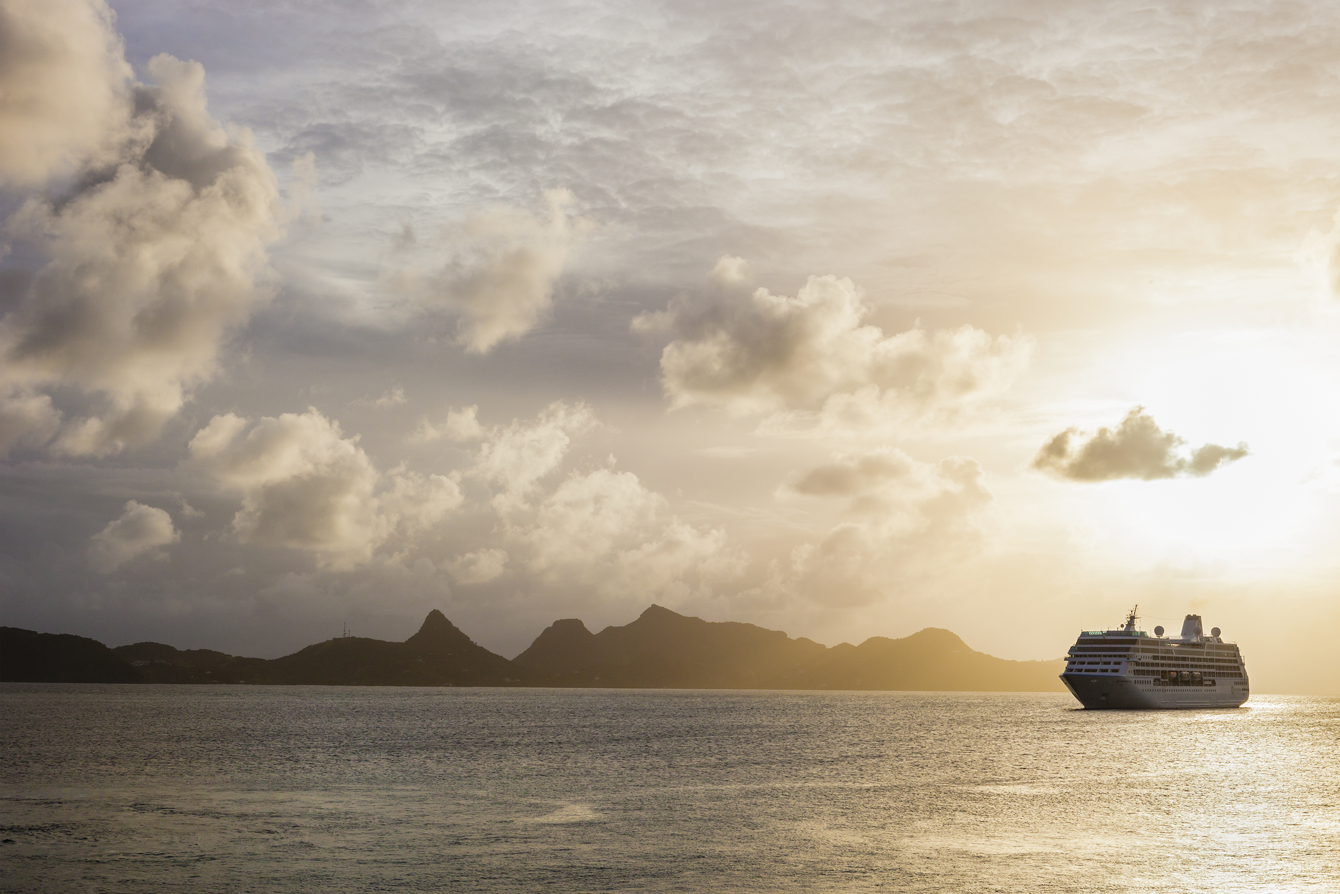 Cruise ship moored off Mayreau Island, one of the Grenadines. The island in the background is Union Island.