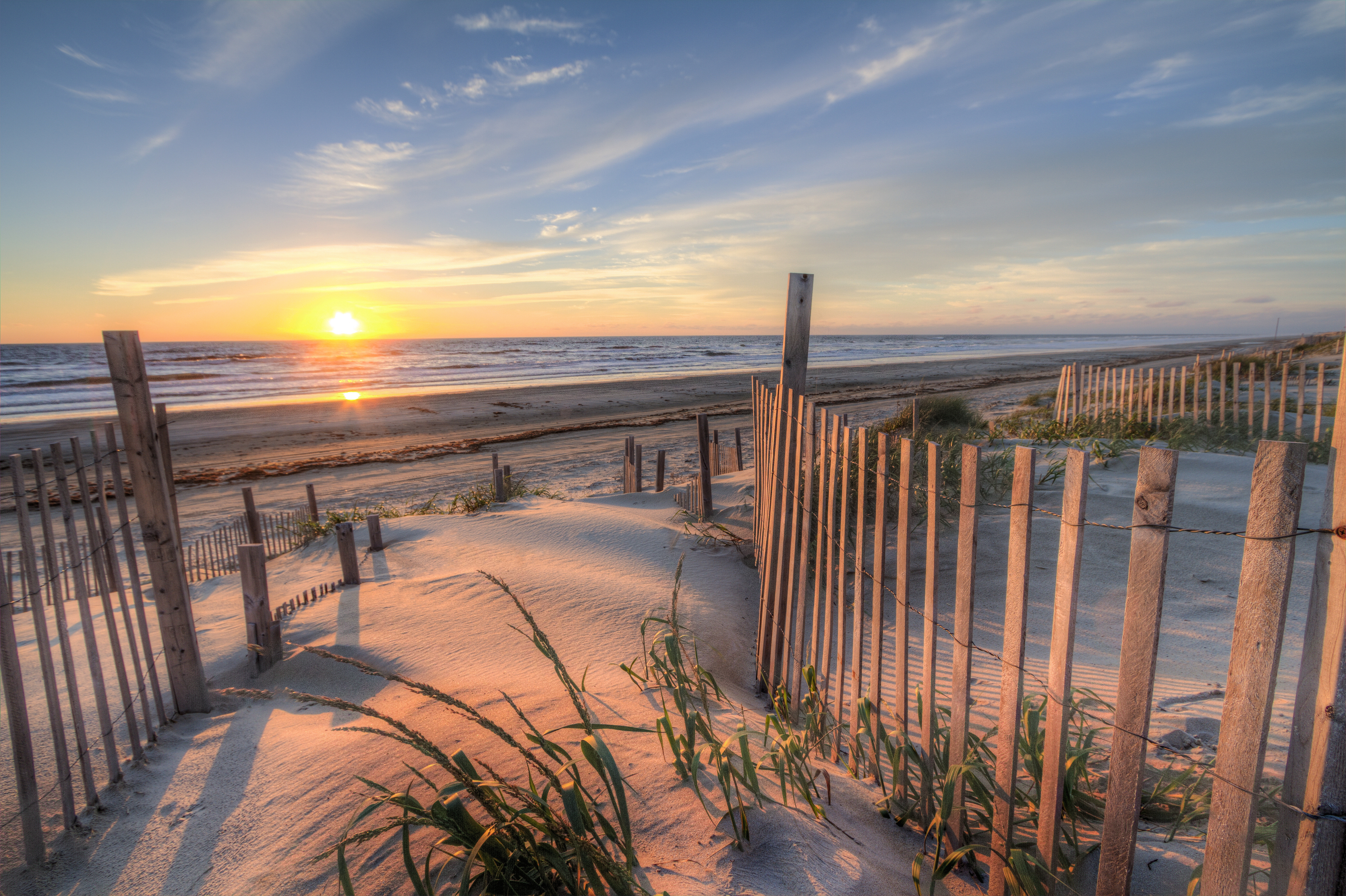 Sunrise as seen from the sand dunes at the Outer Banks, NC around Corolla Beach