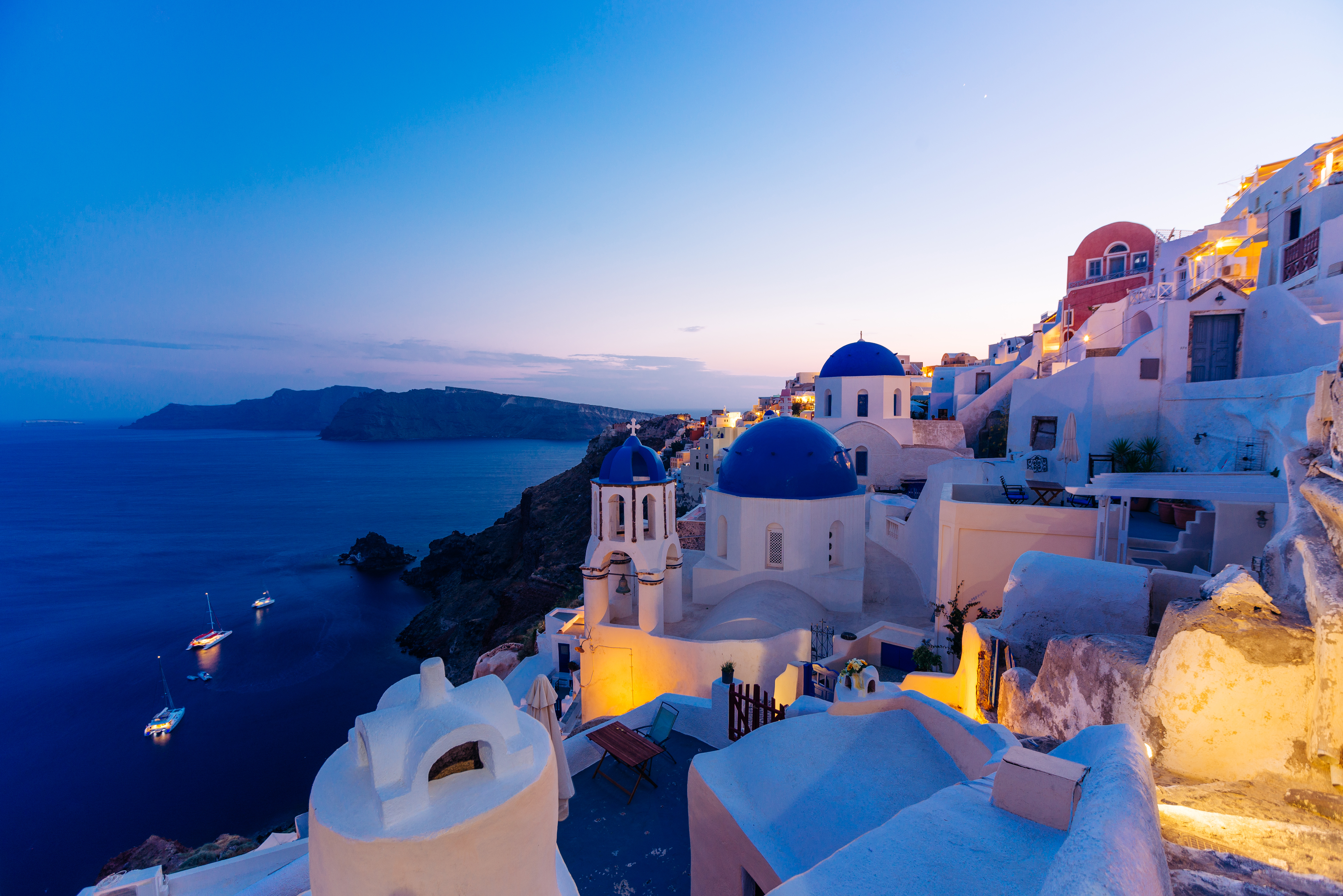 Famous Oia blue dome churches at twilight