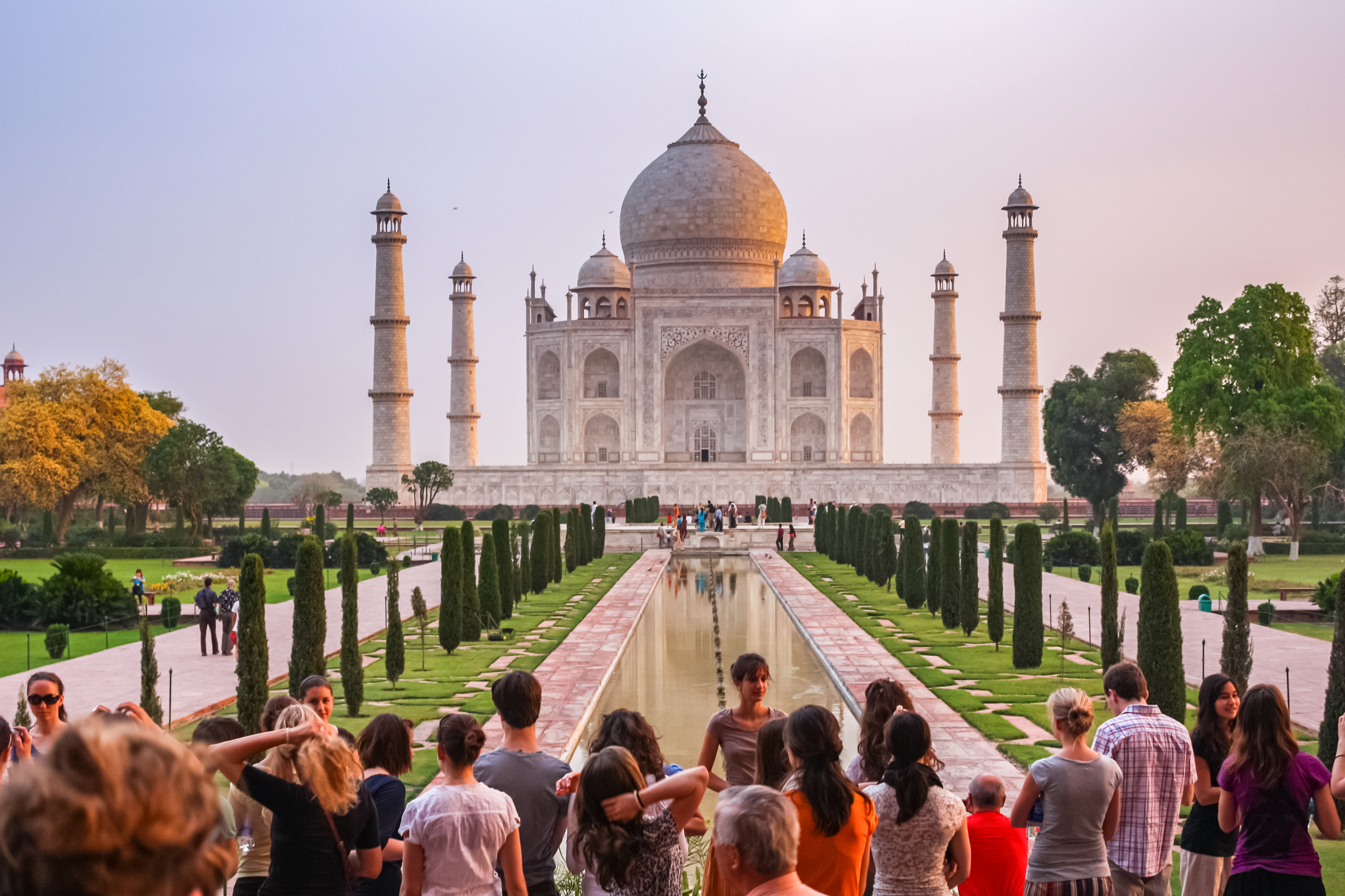 Group of tourists visit the landmark Taj Mahal in Agra, India