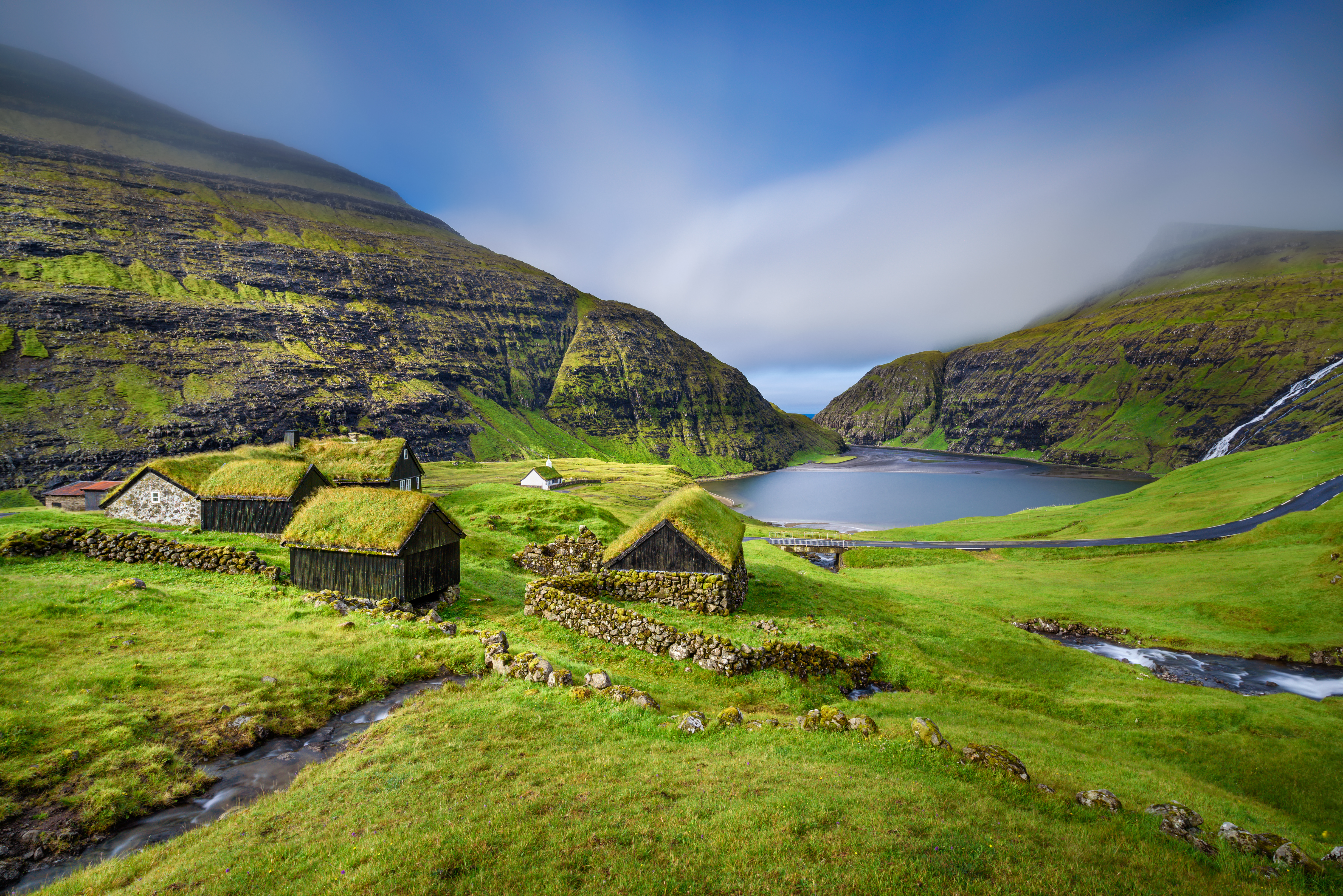 Colorful green landscape of the Village of Saksun located on the island of Streymoy, Faroe Islands
