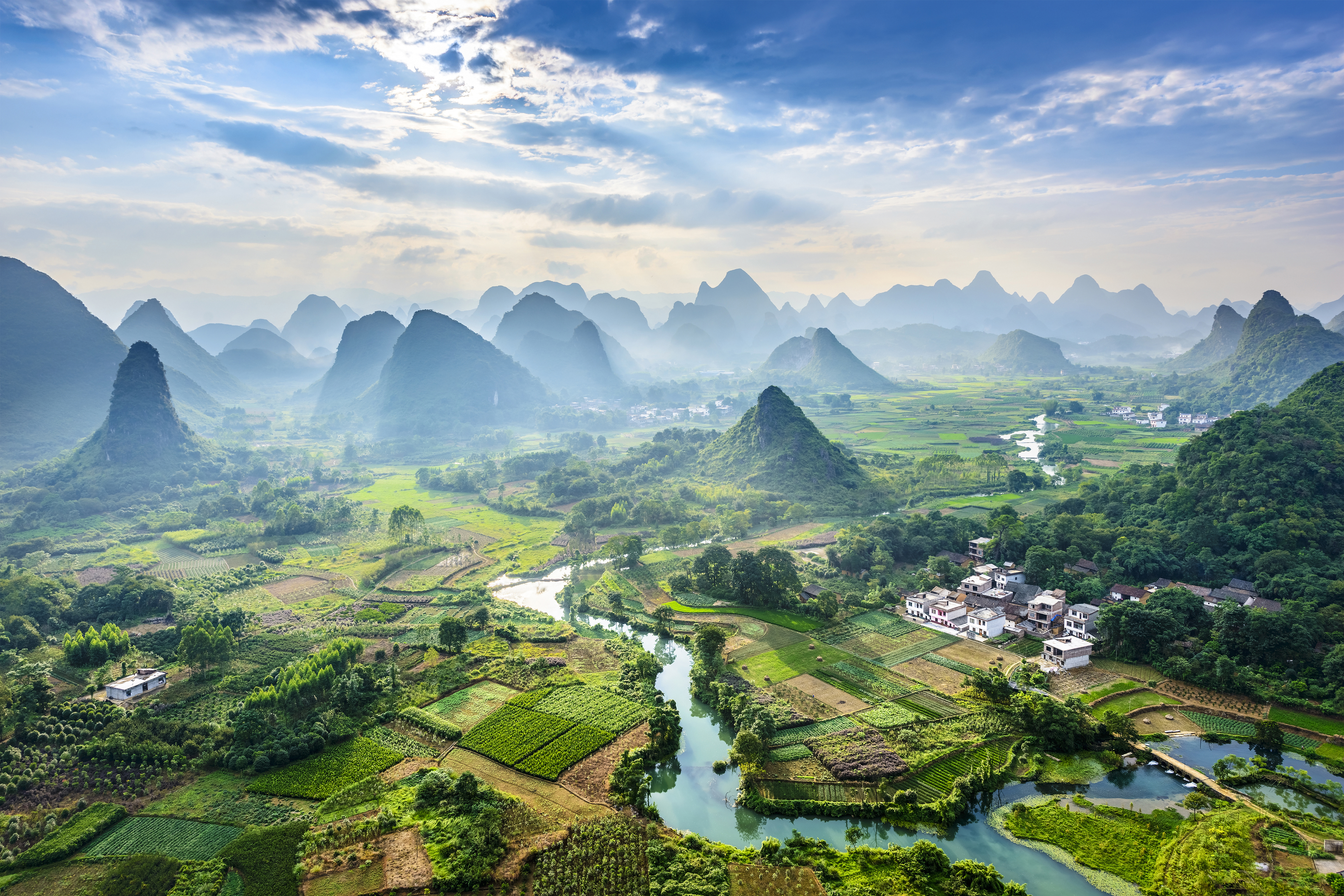 Soaring limestone karst peaks, bordered on one side by the Li River