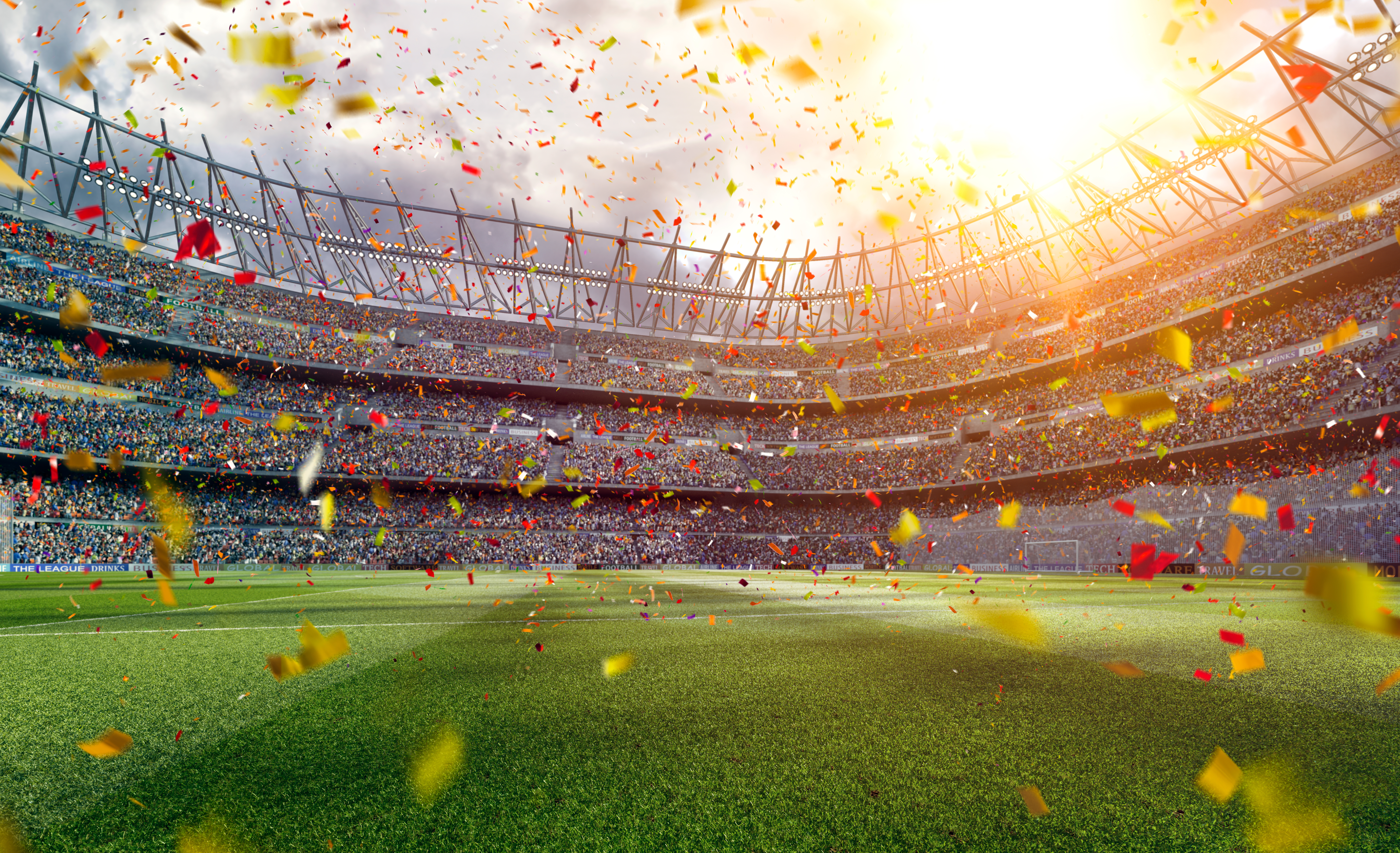 Panoramic view of soccer stadium with crowd on a sunny day