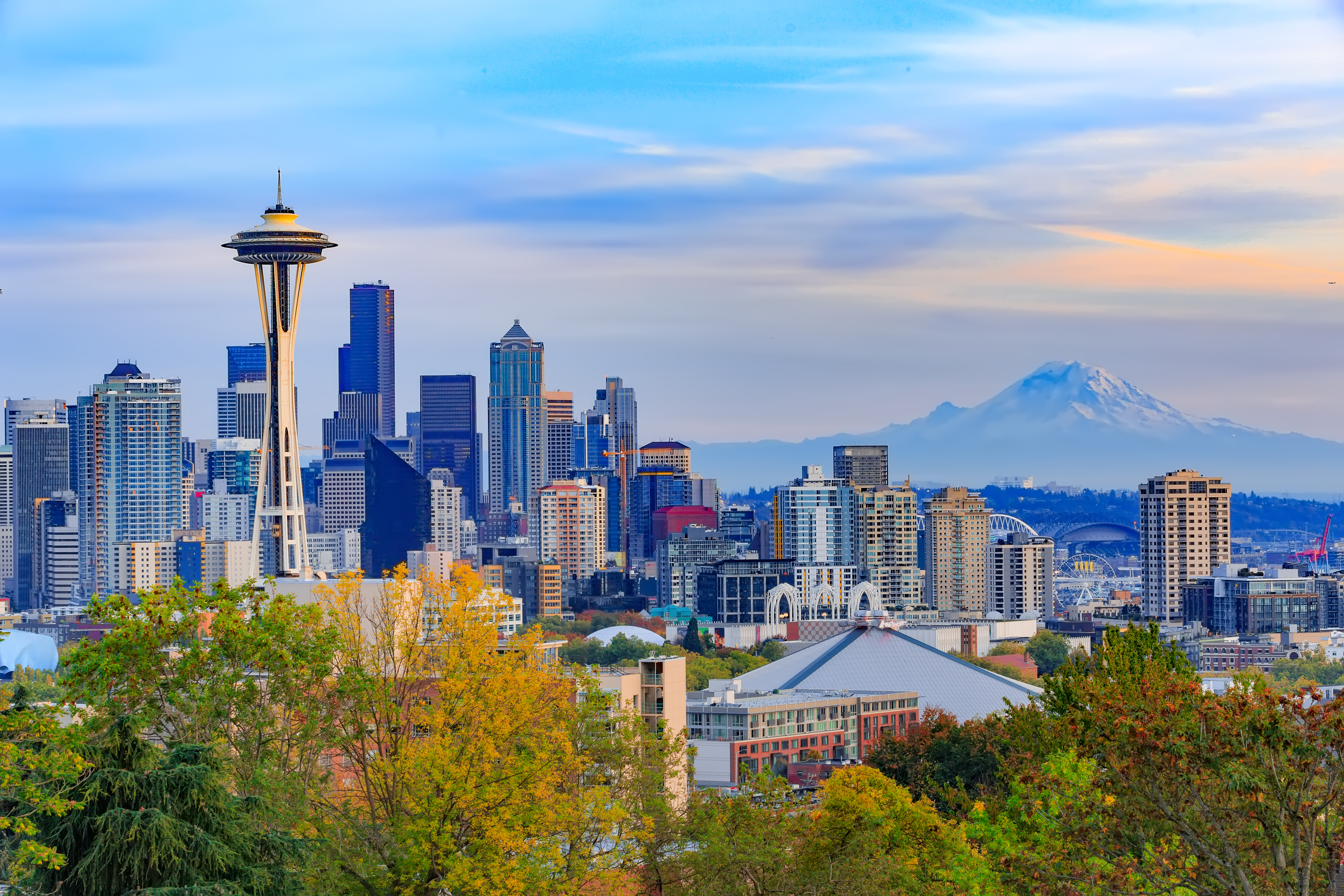 City skyline featuring the space needle with Mount Rainier in the background