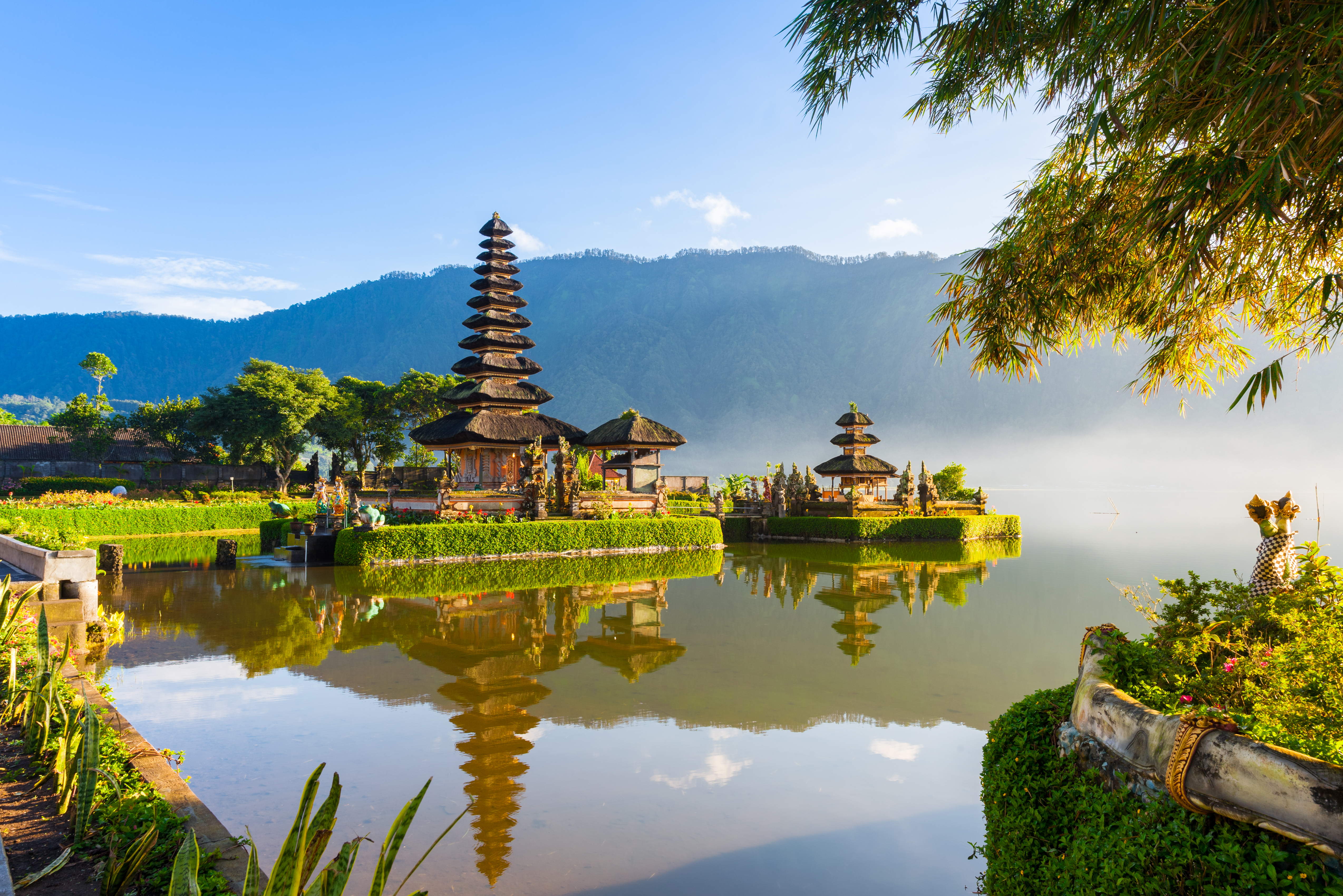 Famous temple with morning mists over the Danau Beratan lake