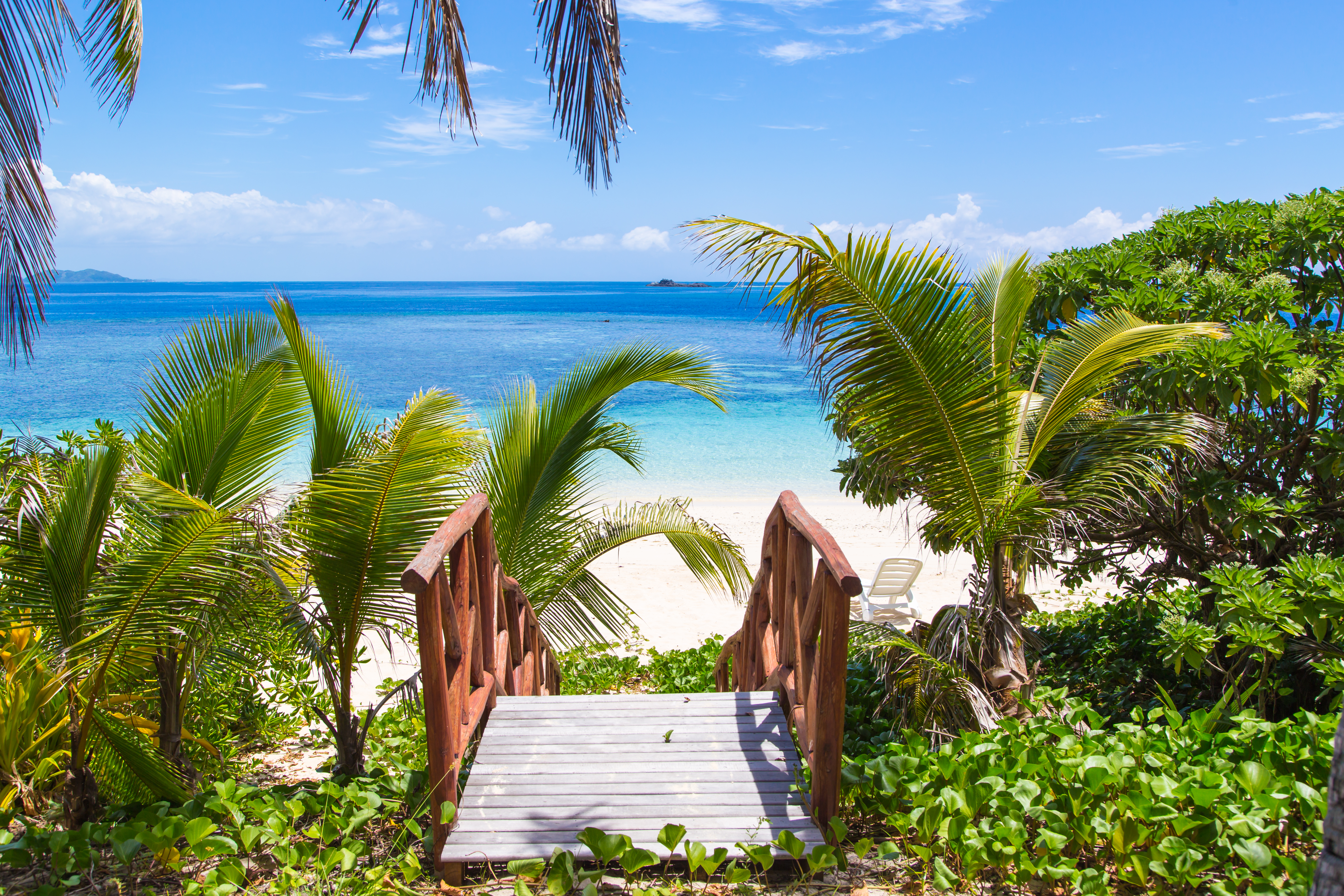 Beach access to tropical waters in Fiji.