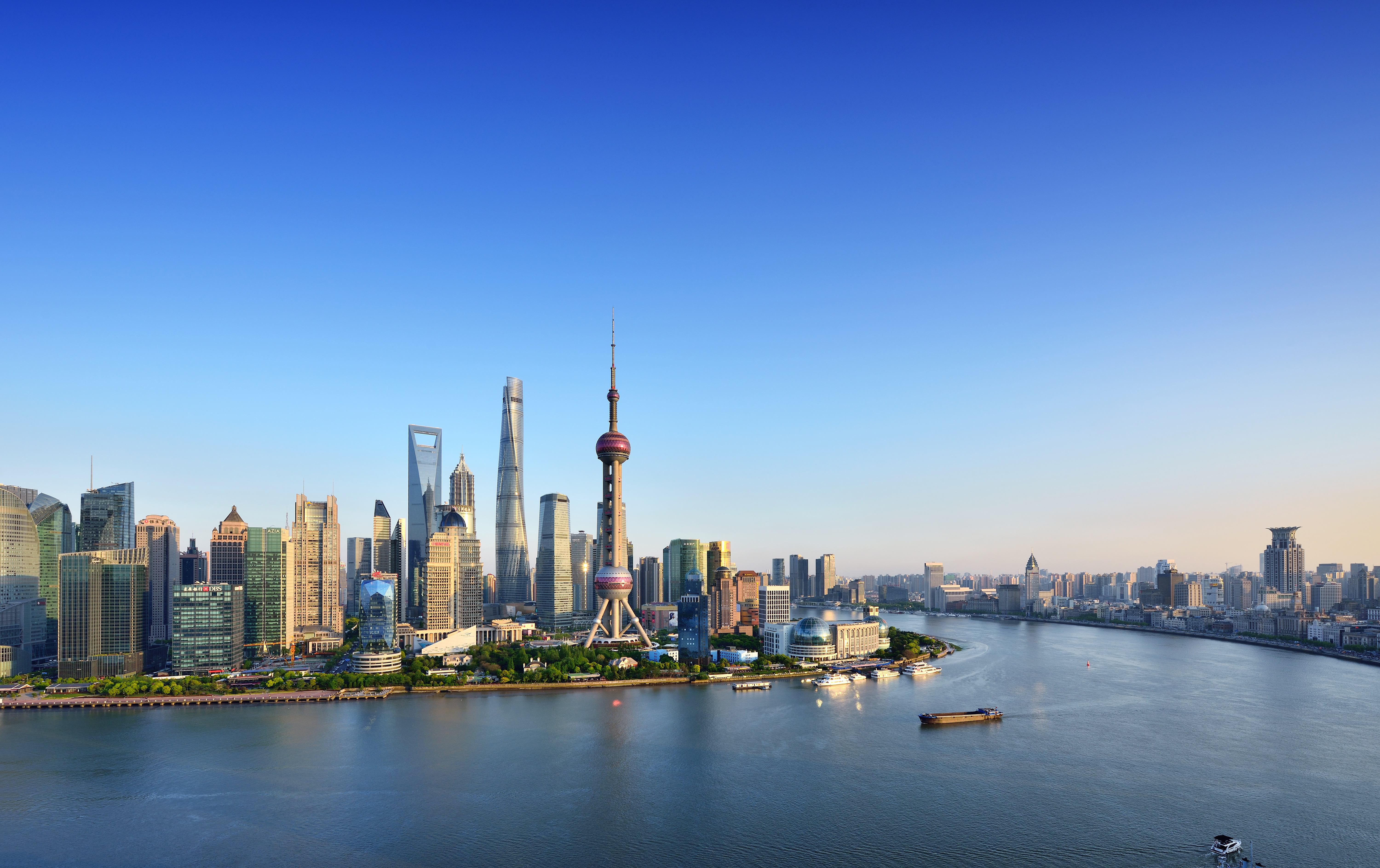 Shanghai skyline in blue sky at sunset