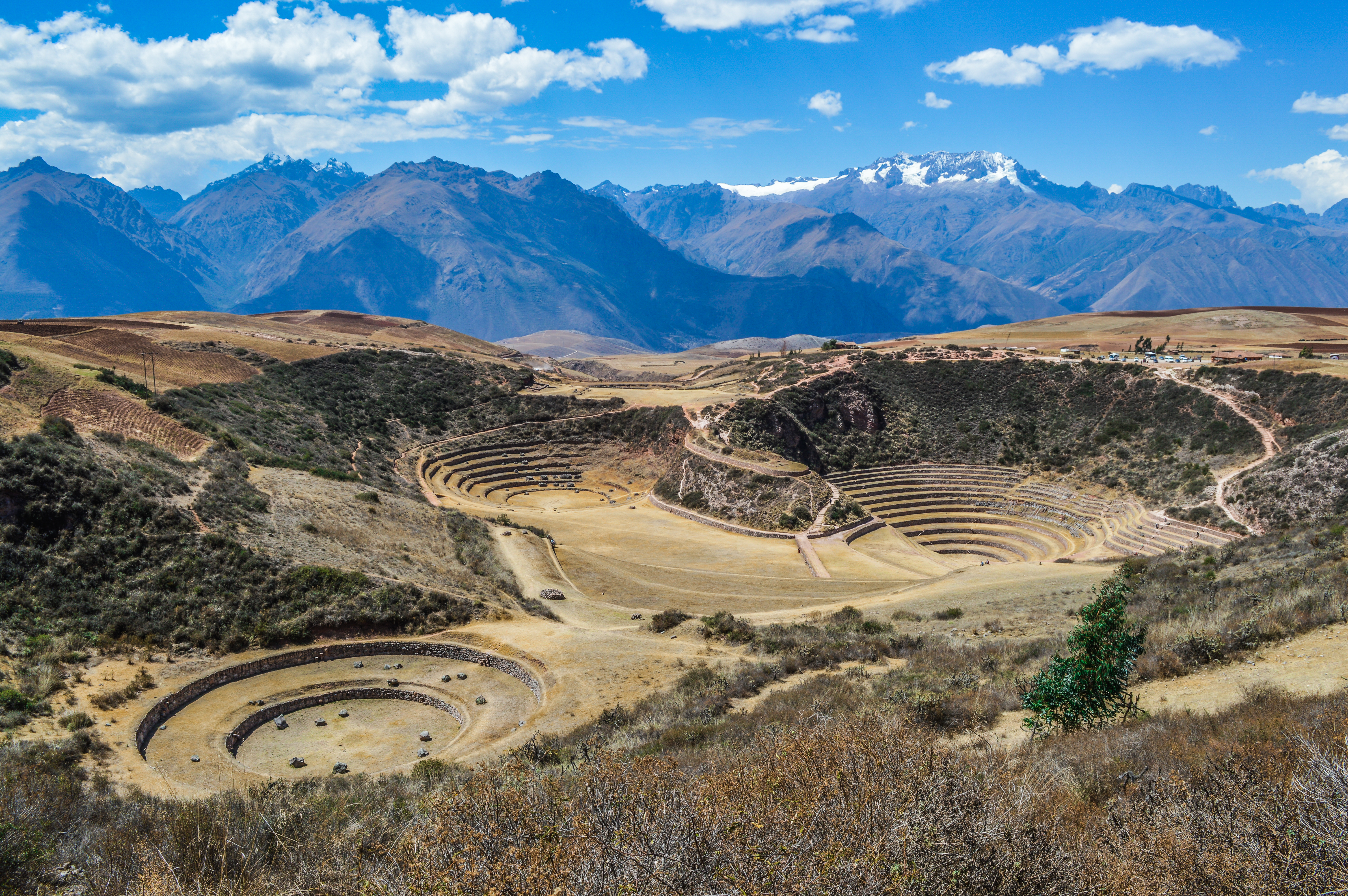 Ancient Inca circular terraces with Andes mountains in the background