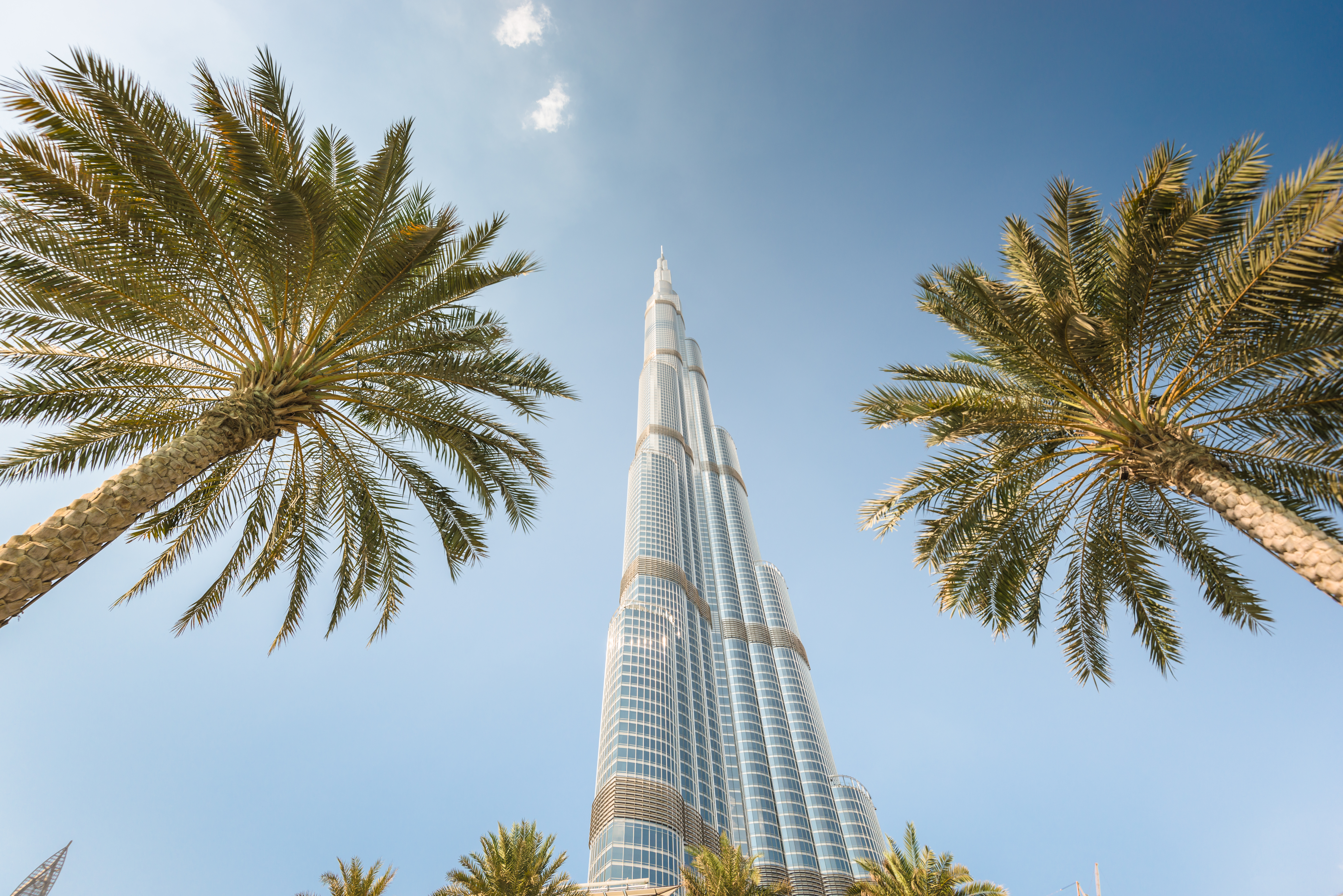 Low angle view of the Burj Khalifa in the city of Dubai on downtown dubai district. the Burj Khalifa tower is the tallest building in the middle east. Sunny day.