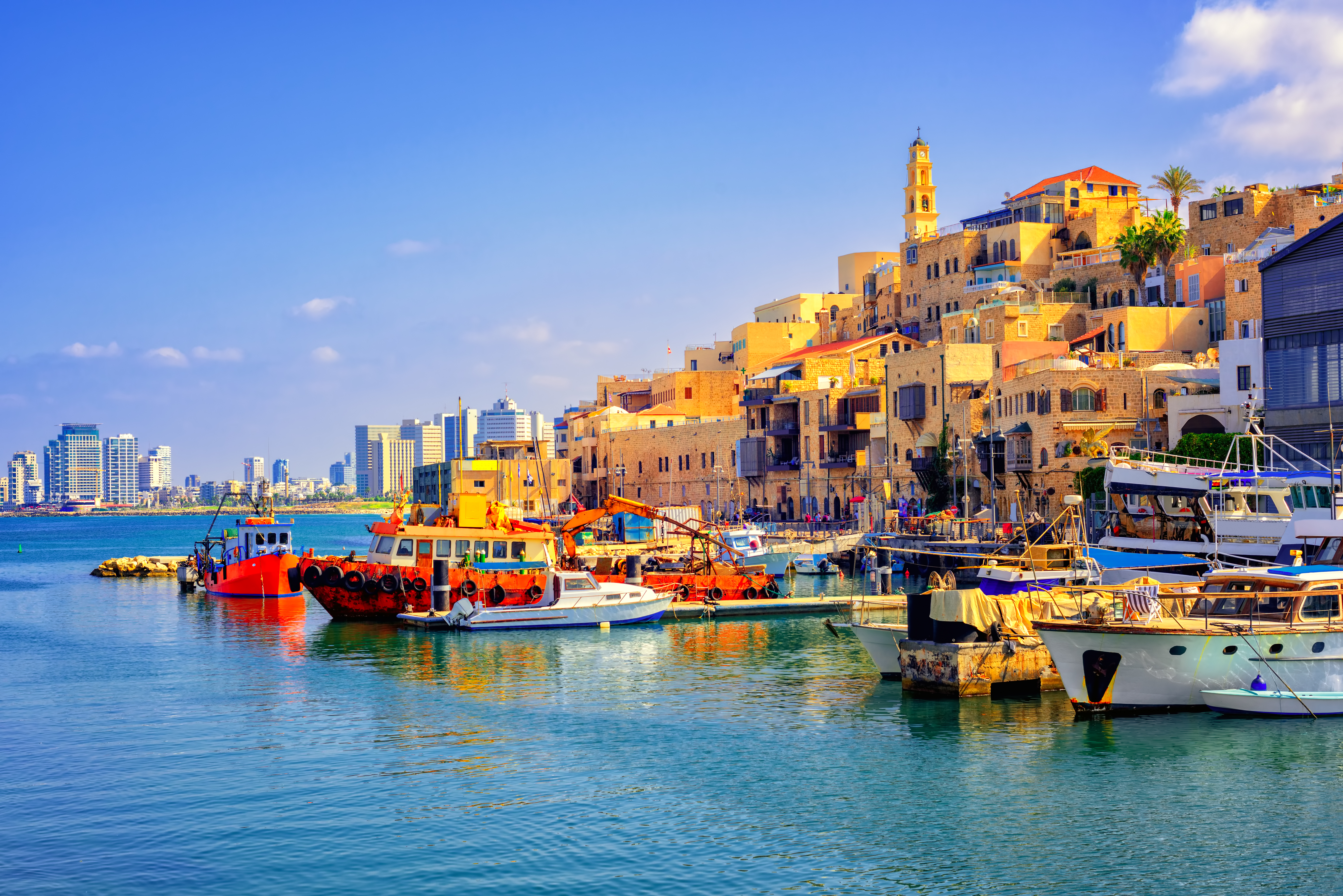 Old town and port of Jaffa and modern skyline of Tel Aviv city