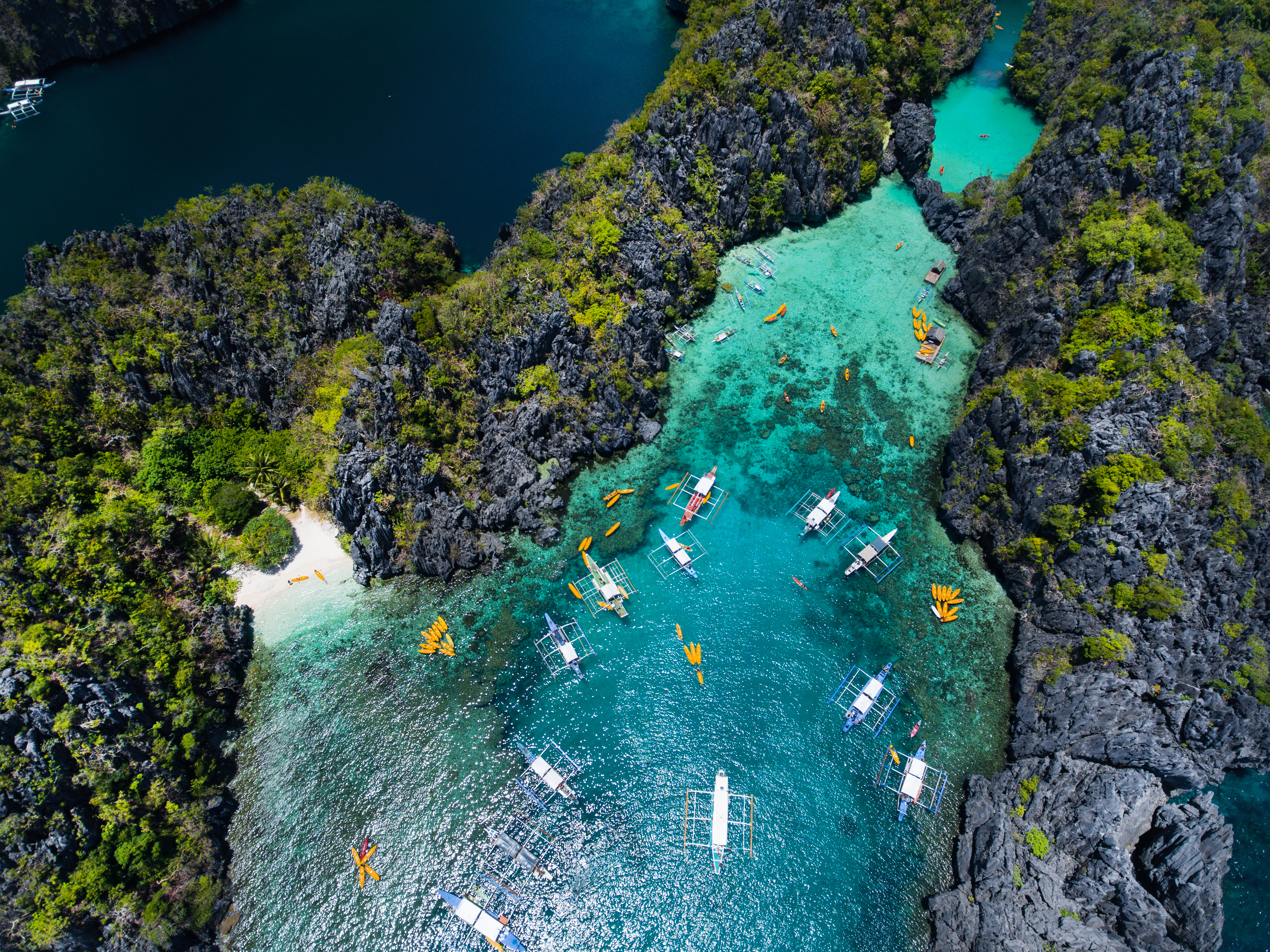 "Aerial view of crystal blue lagoon with boats in El Nido Palawan Philippines  "