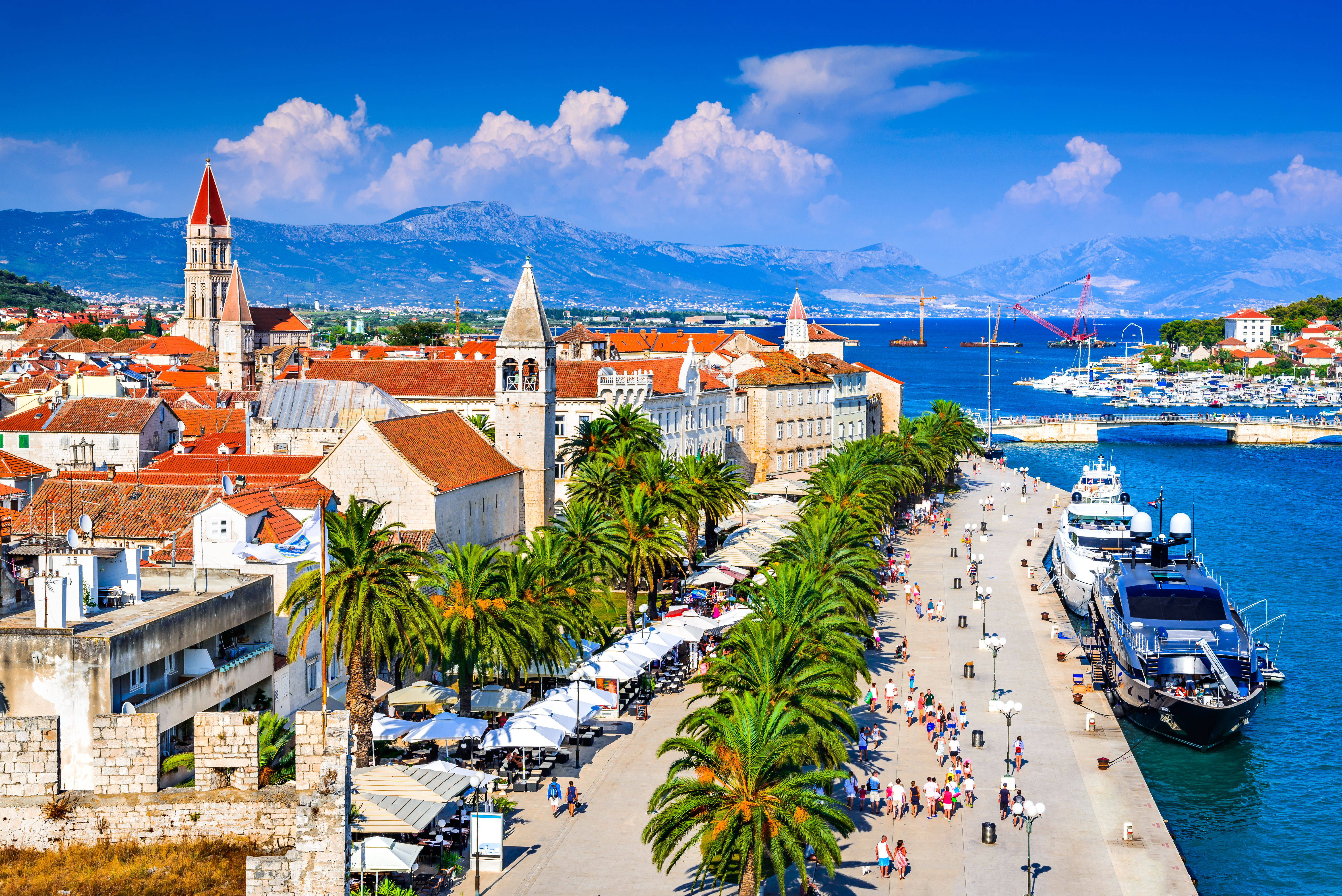 Sunny promenade along the pier of old Venetian town, Dalmatian Coast.