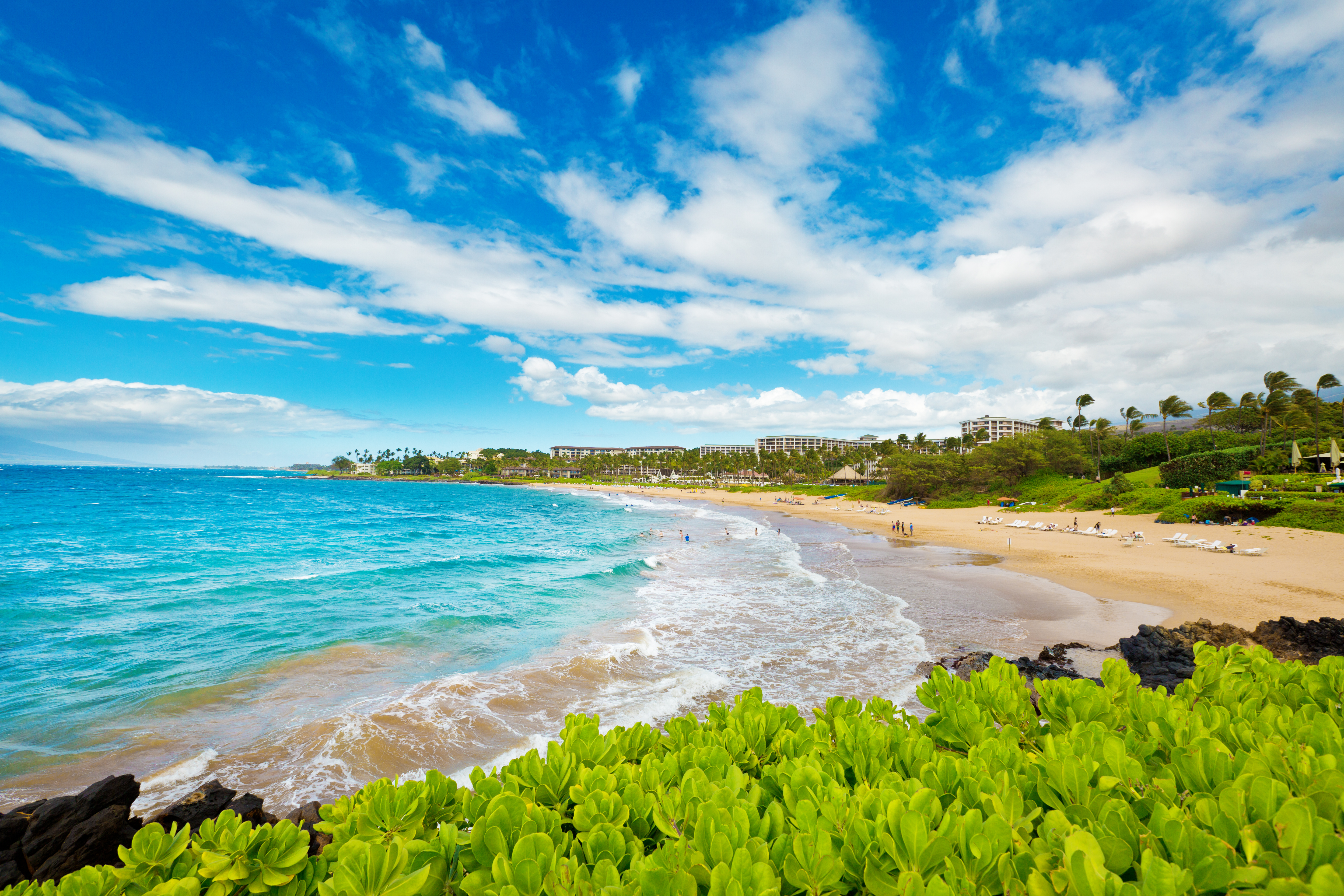 Bright blue waters and white sandy beach