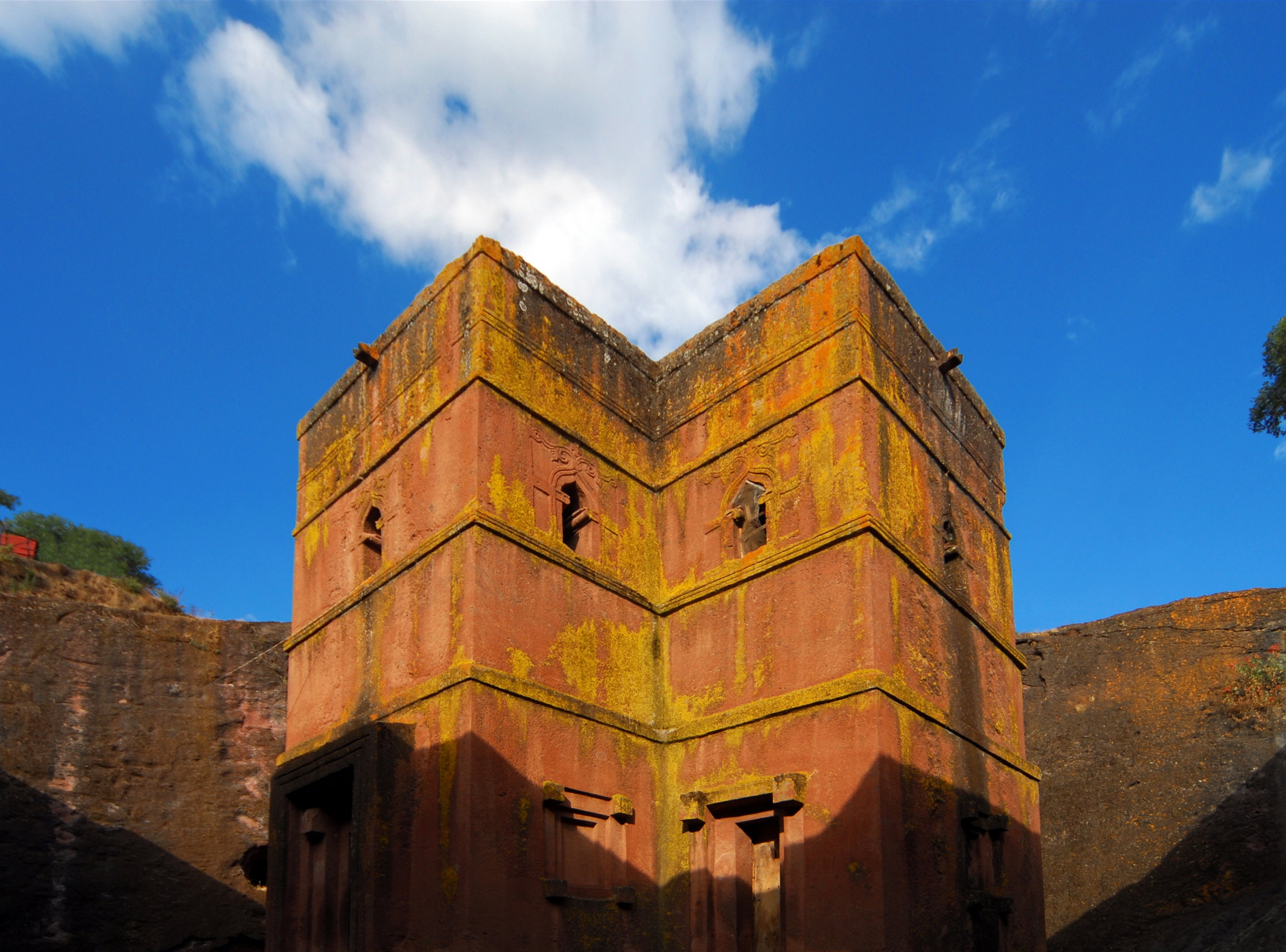 Rock-hewn Church of Saint George / Biete Giyorgis - carved from red volcanic rock in the shape of a cross - 12th century