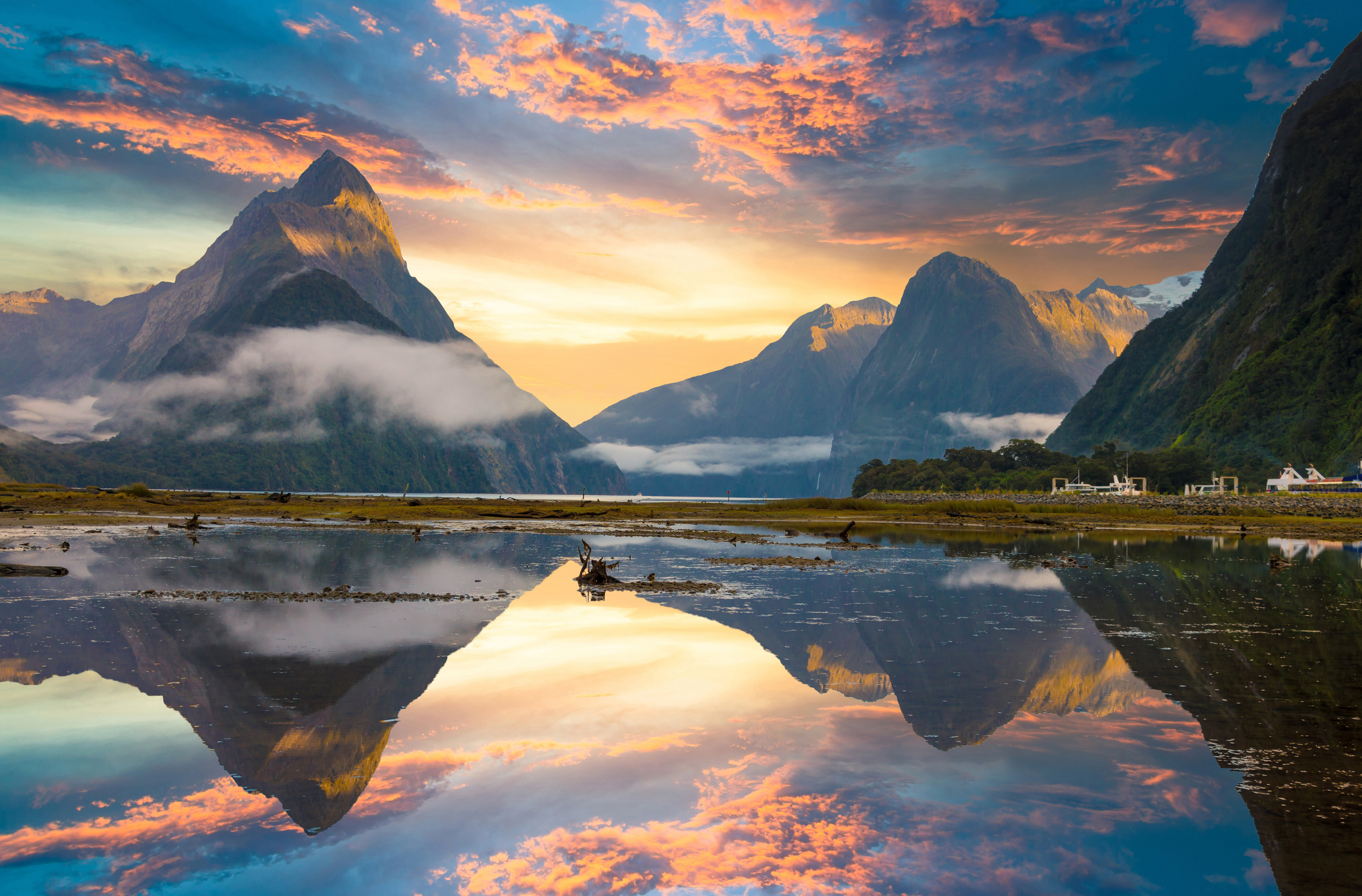 Famous Mitre Peak rising from the Milford Sound fiord. Fiordland national park,
