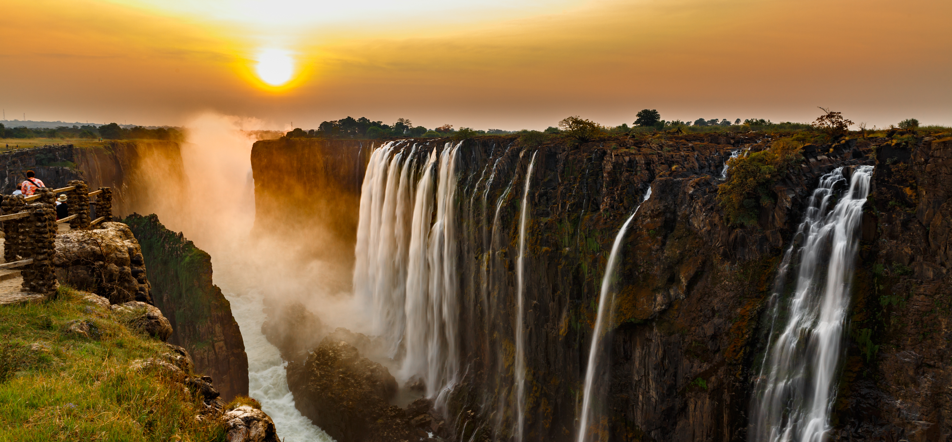 Panorama of Victoria Falls at sunset.