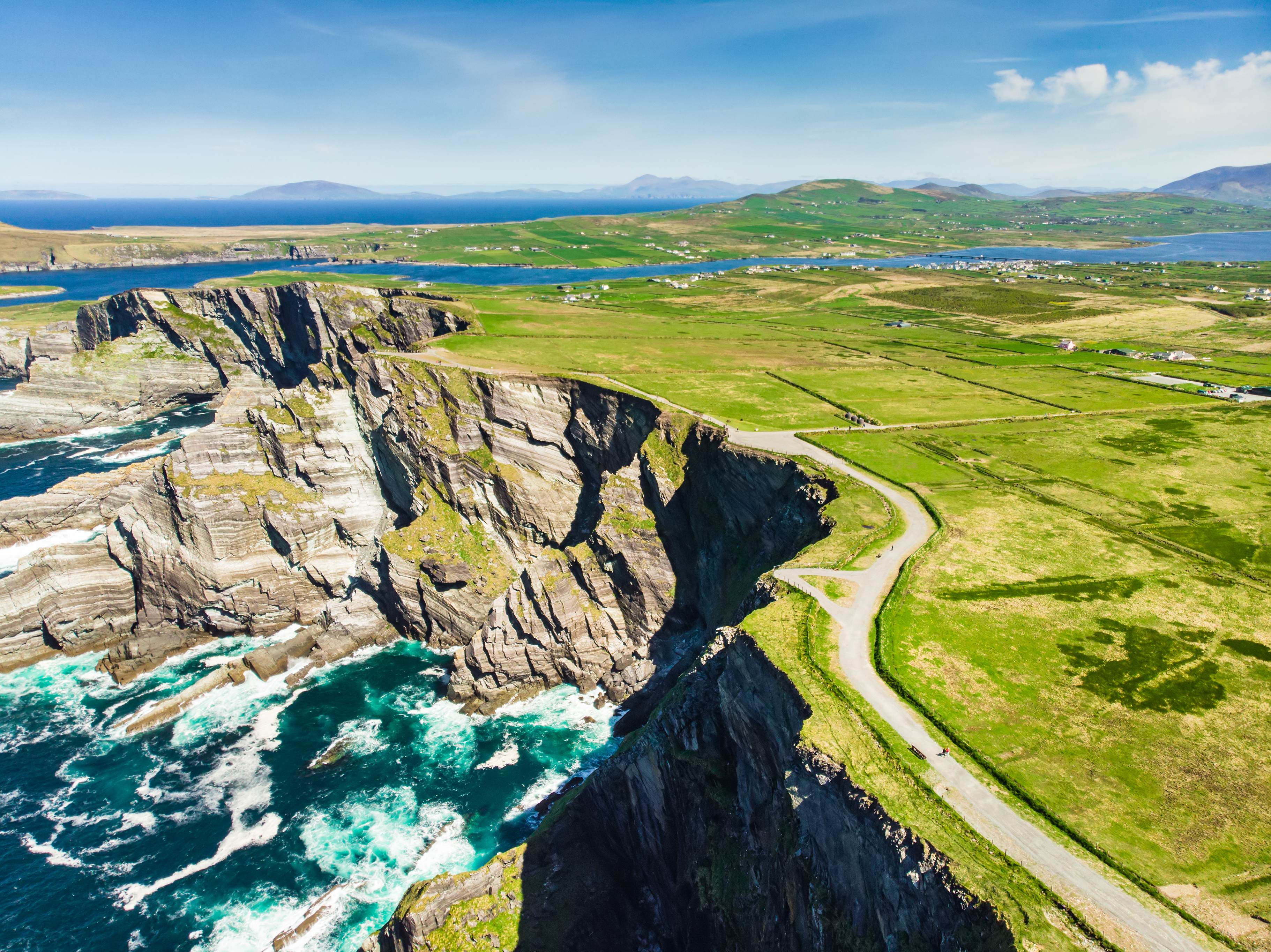 Amazing wave lashed Kerry Cliffs, the most spectacular cliffs in County Kerry, Ireland. Tourist attractions on famous Ring of Kerry route.