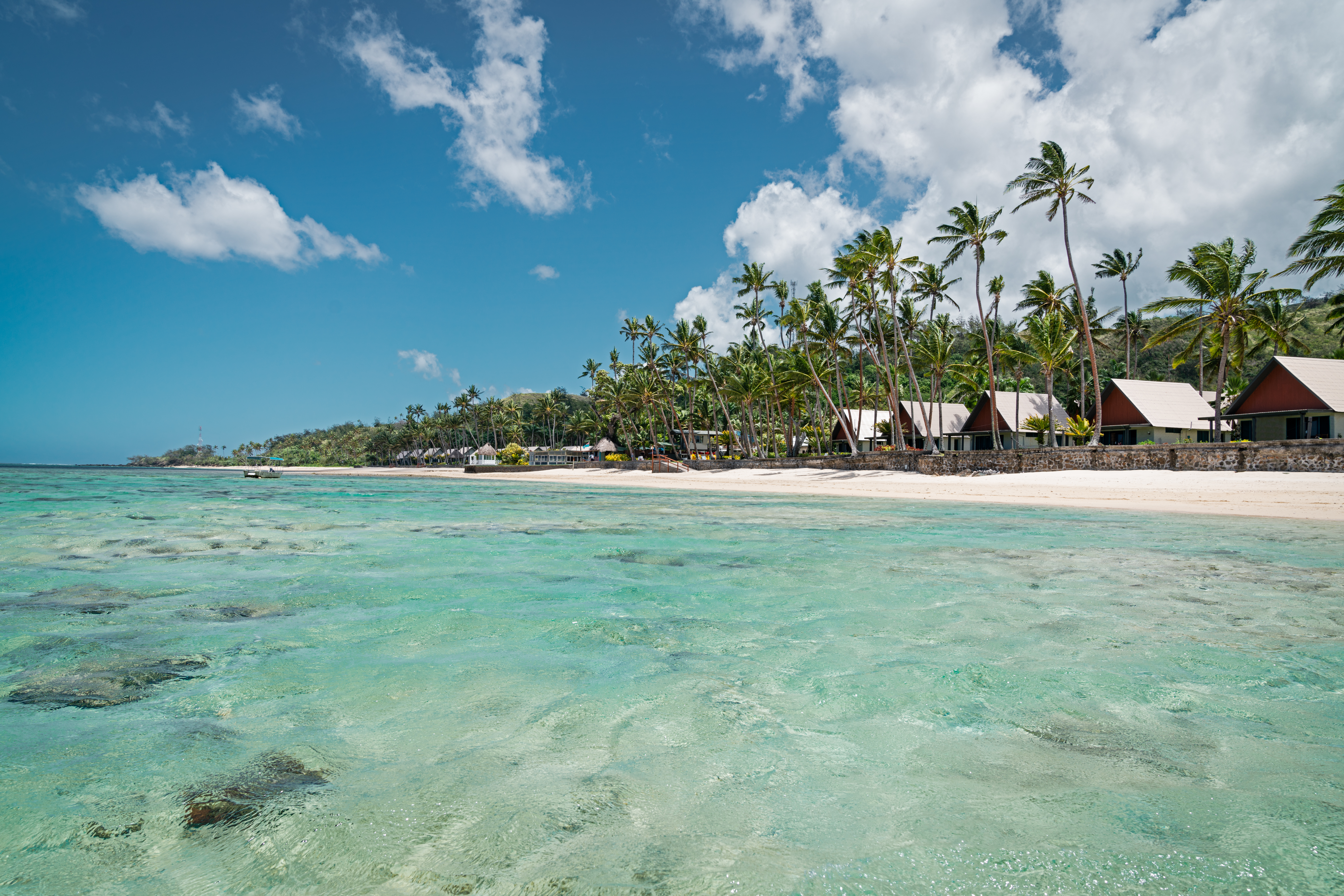 beach with villas and clear waters in the tropics
