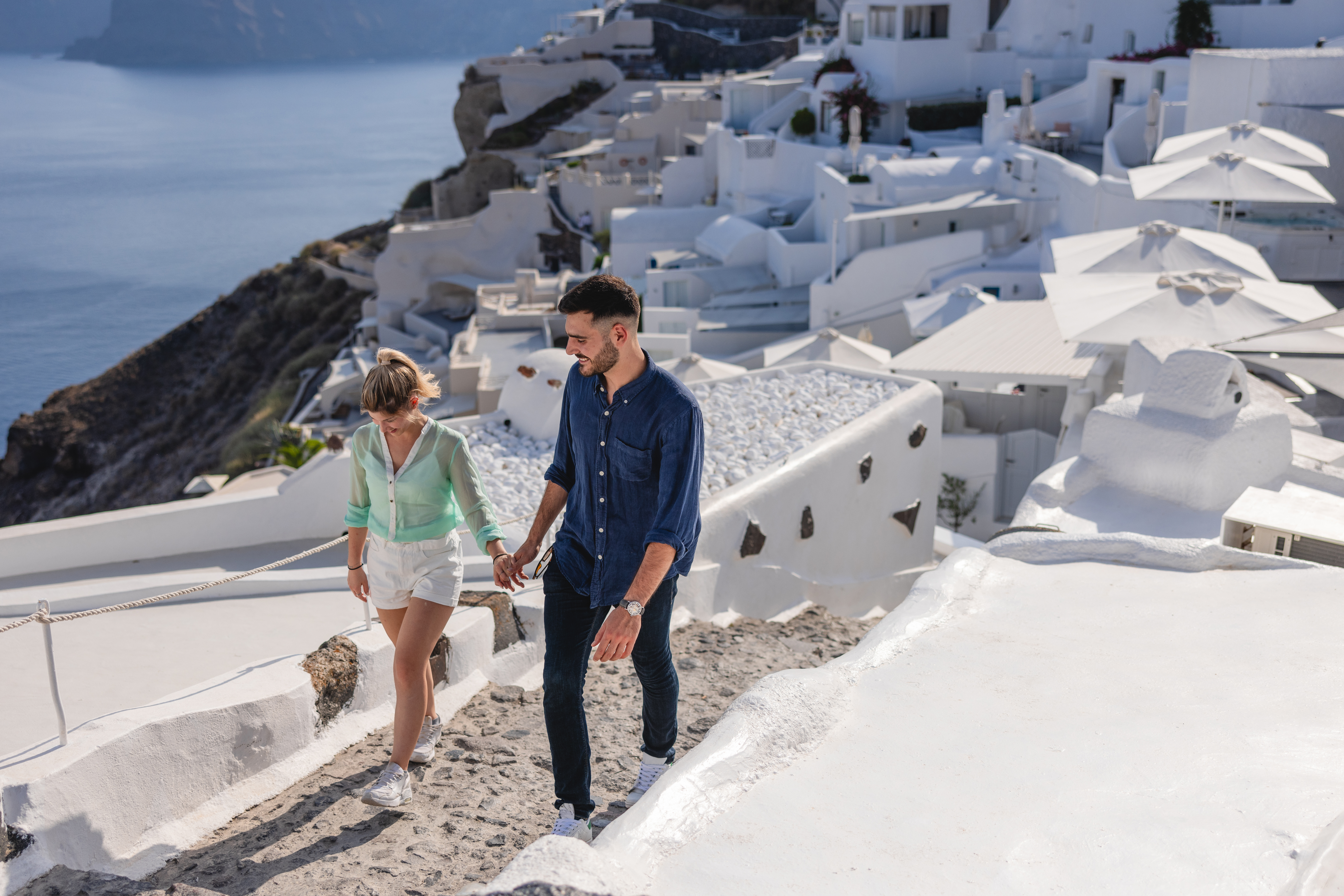Couple walking around the beautiful village of Oia