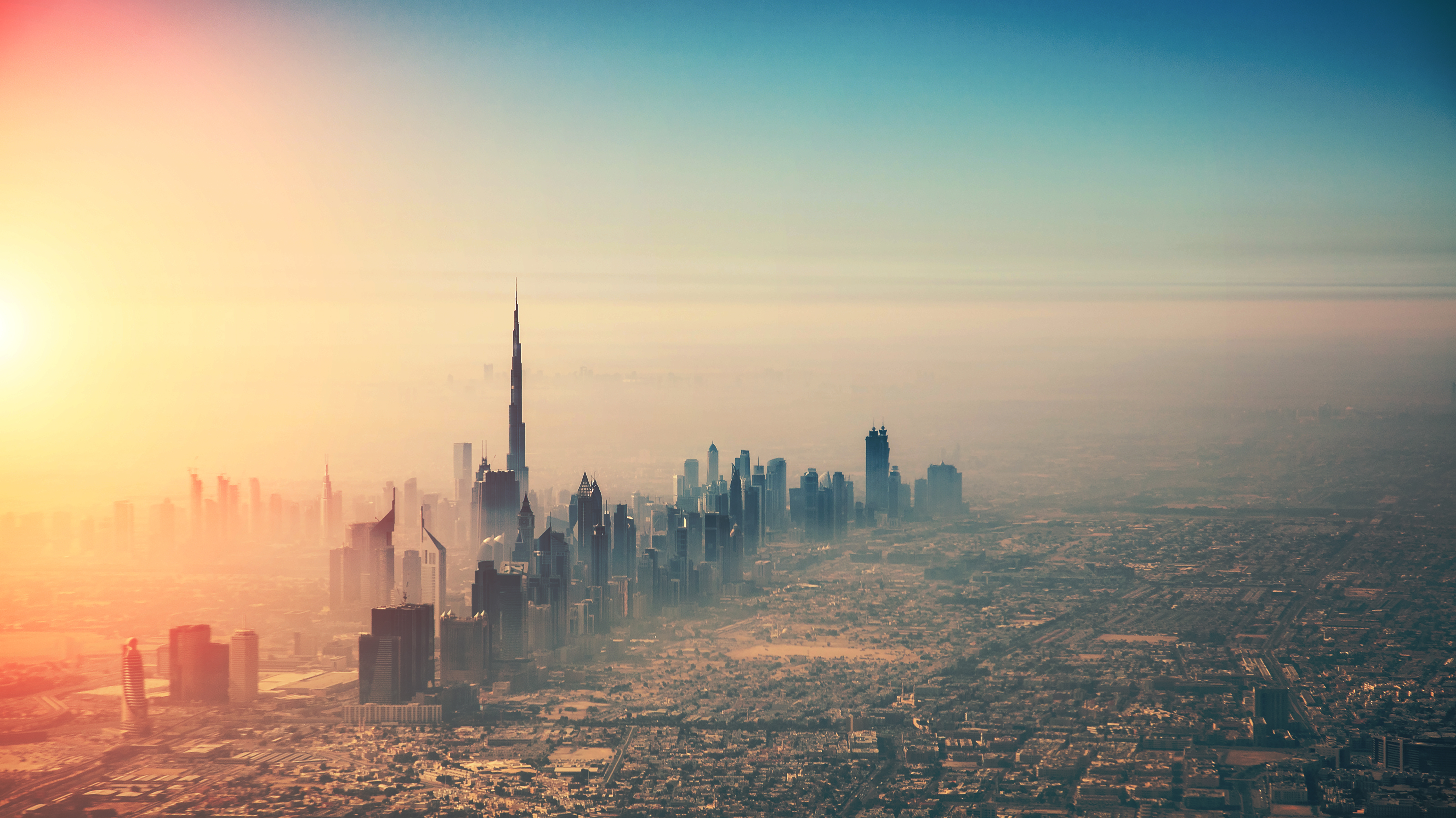 aerial view of city skyline draped in mist
