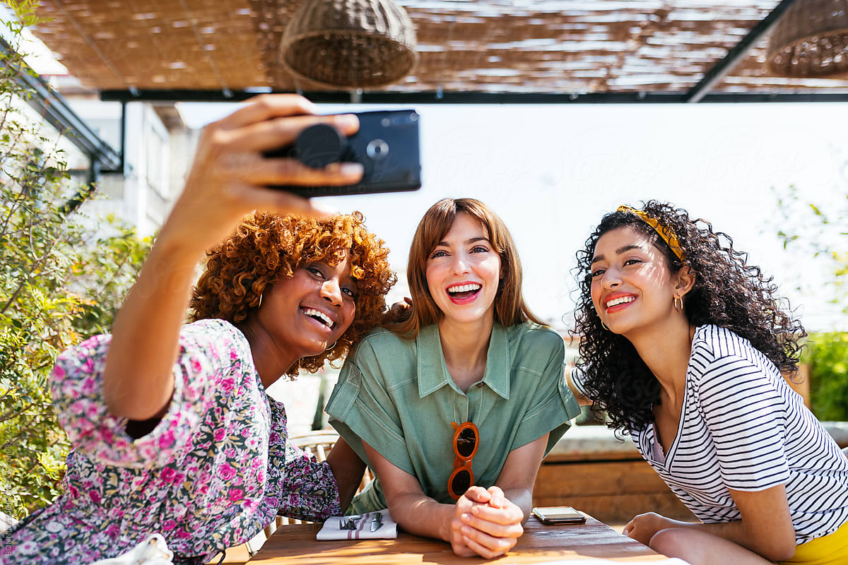 female friends taking a photo together