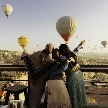 Tourists view hot air baloons