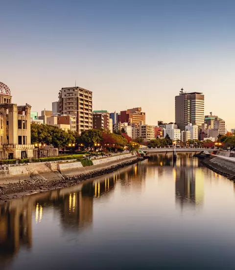 Panorama of Hiroshima Cityscape at Twilight. View over the Ota River, Atomic Bomb Dome illuminated on the left side of the river