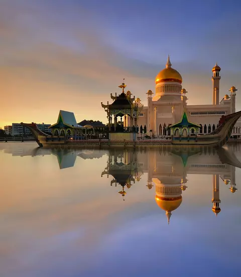 Sunset view of Sultan Omar Ali Saifudding Mosque, Bandar Seri Begawan, Brunei, Southeast Asia with reflection in water