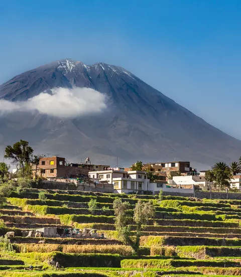 Dormant Misti Volcano over the fields and houses of peruvian city of Arequipa, Peru