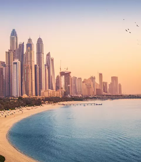 Sunset view of the Dubai Marina and tthe golden sand beaches in the Persian Gulf