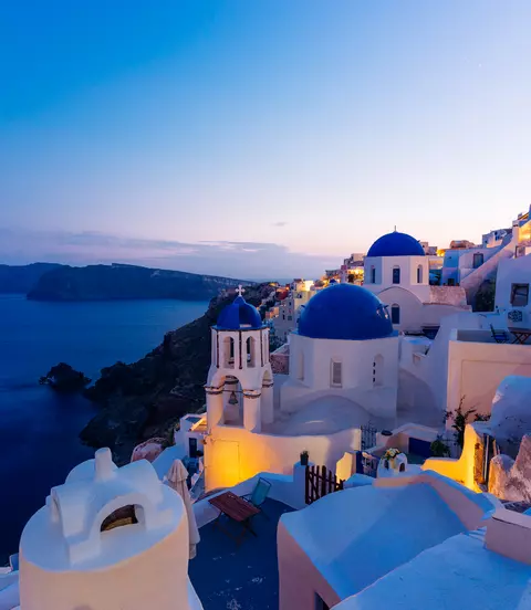 Famous Oia blue dome churches at twilight