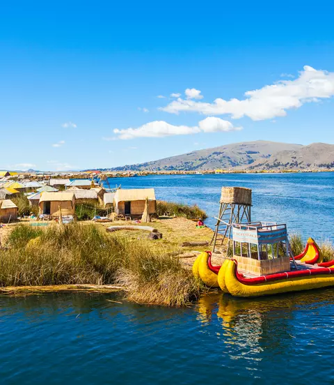 Uros fishing boat floating on Titicaca Lake near Puno, Peru