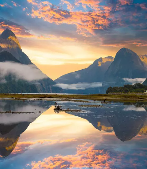 Famous Mitre Peak rising from the Milford Sound fiord. Fiordland national park,