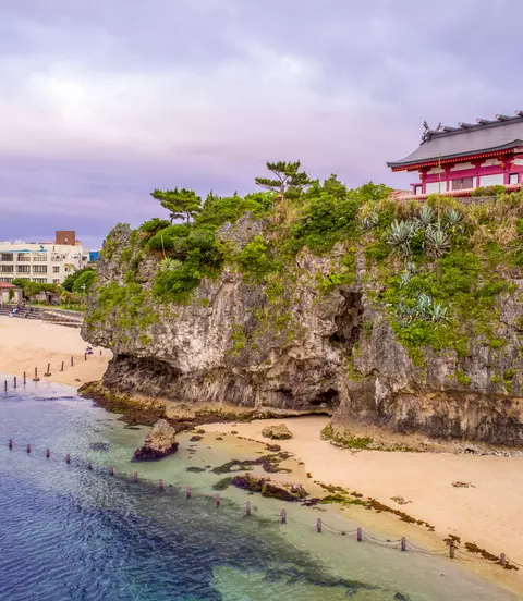 Japanese shrine on hill over breach and ocean
