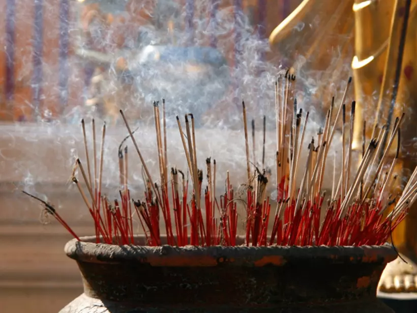 Burning incense sticks at a Buddhist temple