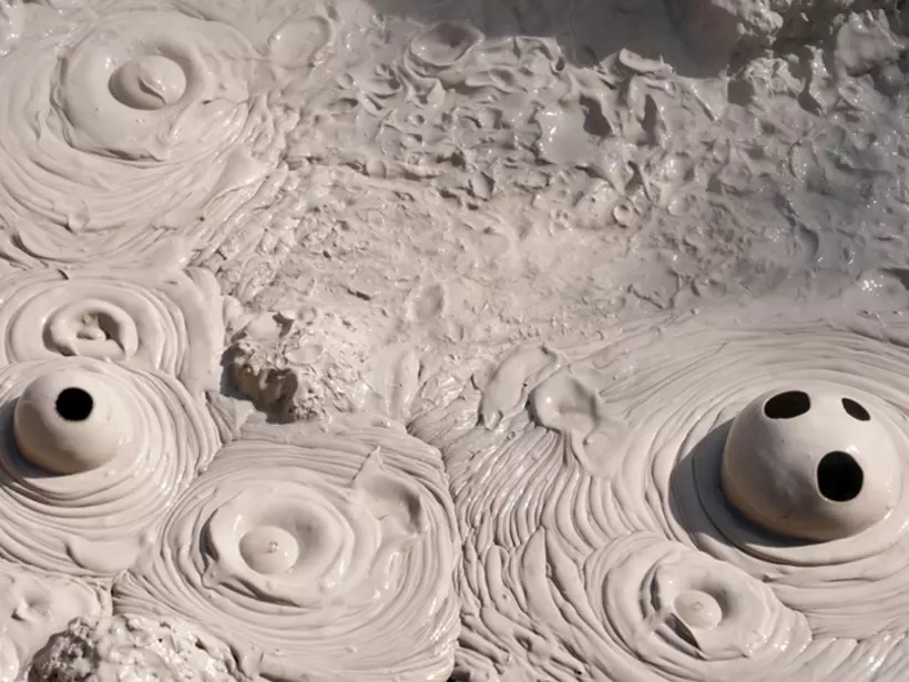 Mud pool in Wai-o-tapu thermal wonderland is an ideal photo opportunity on your New Zealand vacation.