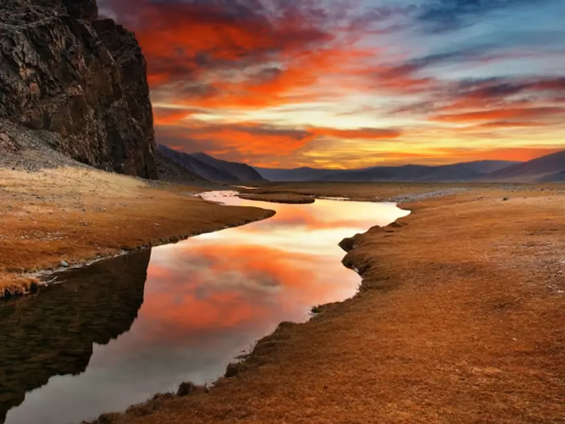 A Mongolian desert sunrise a highlight of many Mongolia tours.