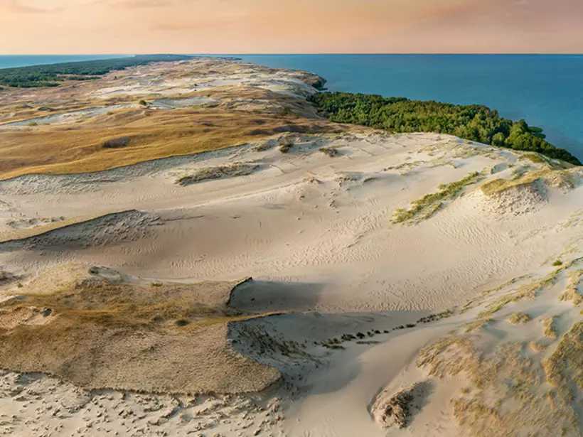 Explore the desert landscape of the Curonian Spit that lies at the north end of Lithuania