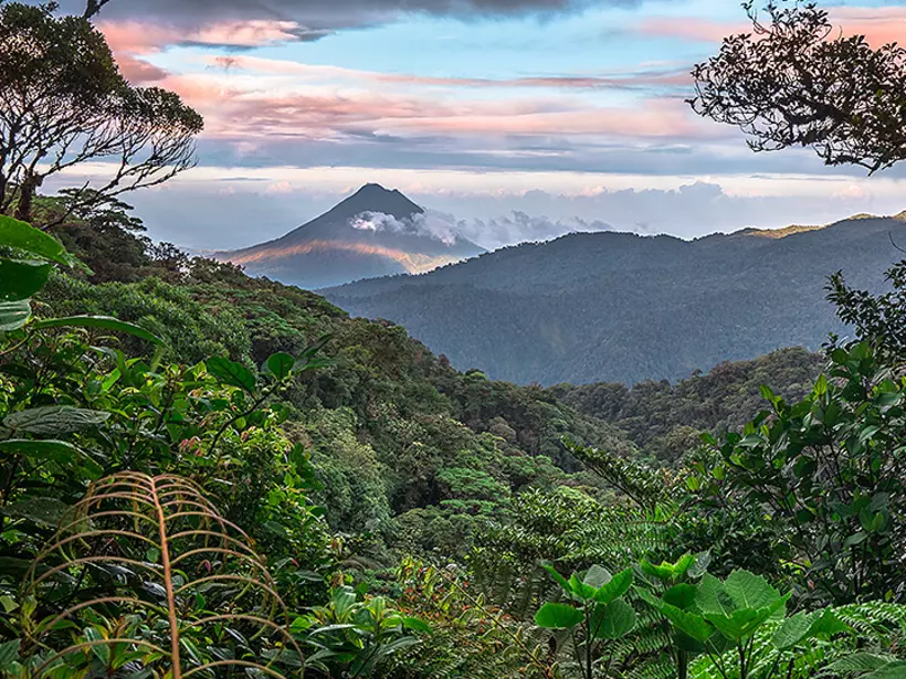 The Arenal Volcano surrounded by lush rainforests 