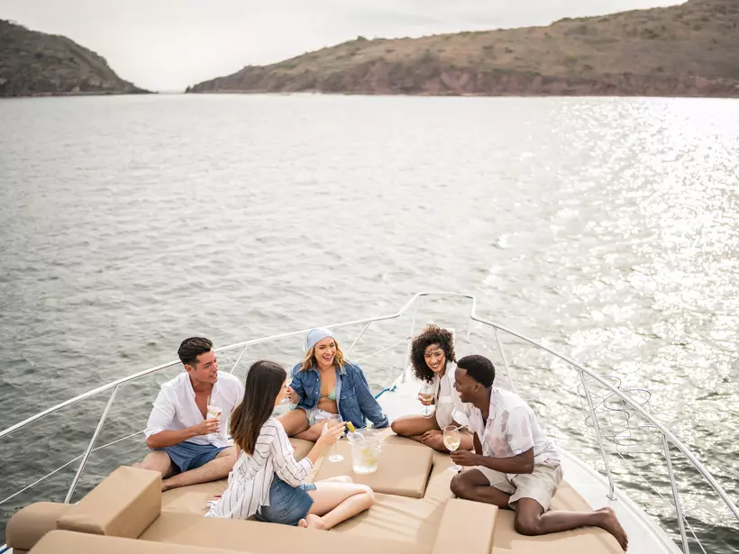 Friends lounge on a boat