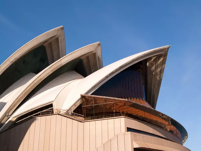 A section of the iconic sails of the Sydney Opera House, seen from the northern side on a bright morning